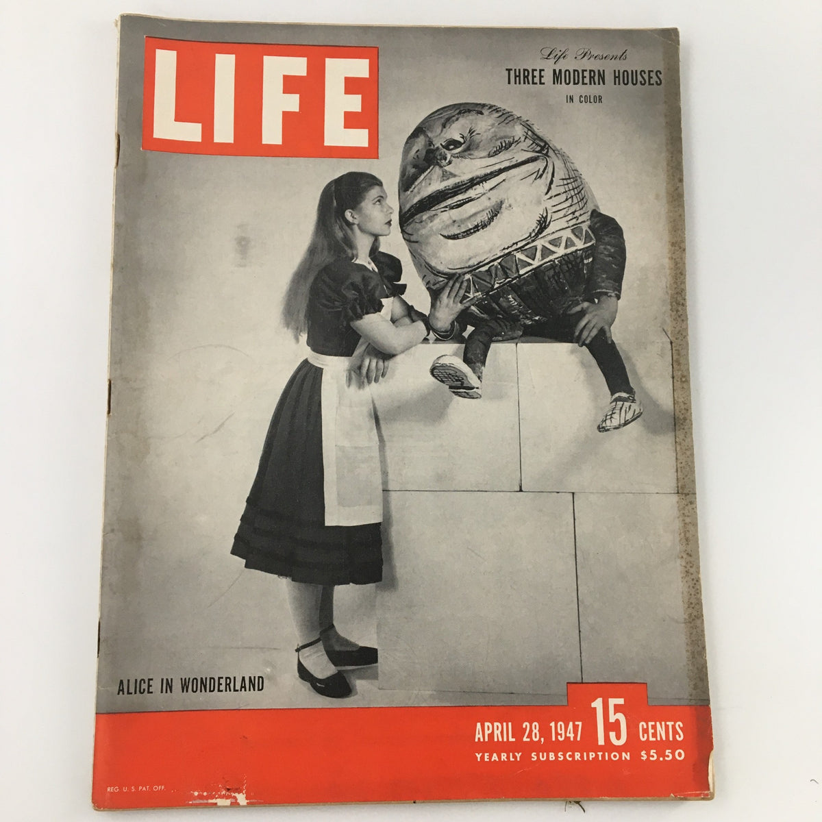 Cover of Life Magazine April 28 1947 showcasing the article 'Three Modern Houses in Color', featuring a girl in a dress and a whimsical large character in a suit.