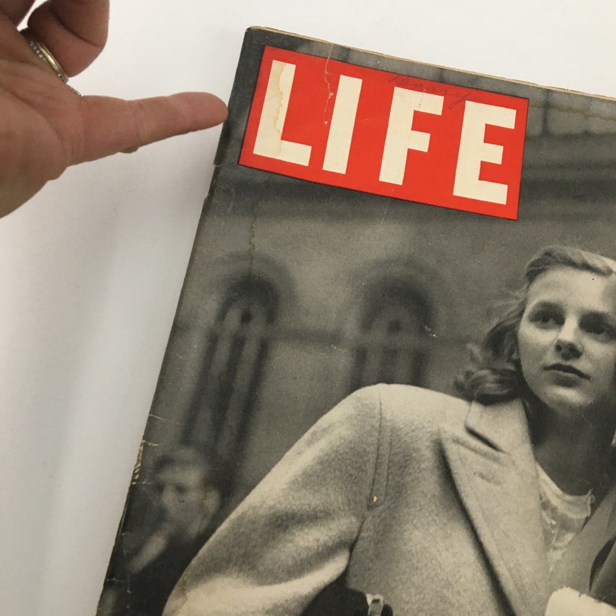Close-up view of the cover of VTG Life Magazine April 19 1943, highlighting the title 'LIFE' and the photograph of a soldier and a woman.
