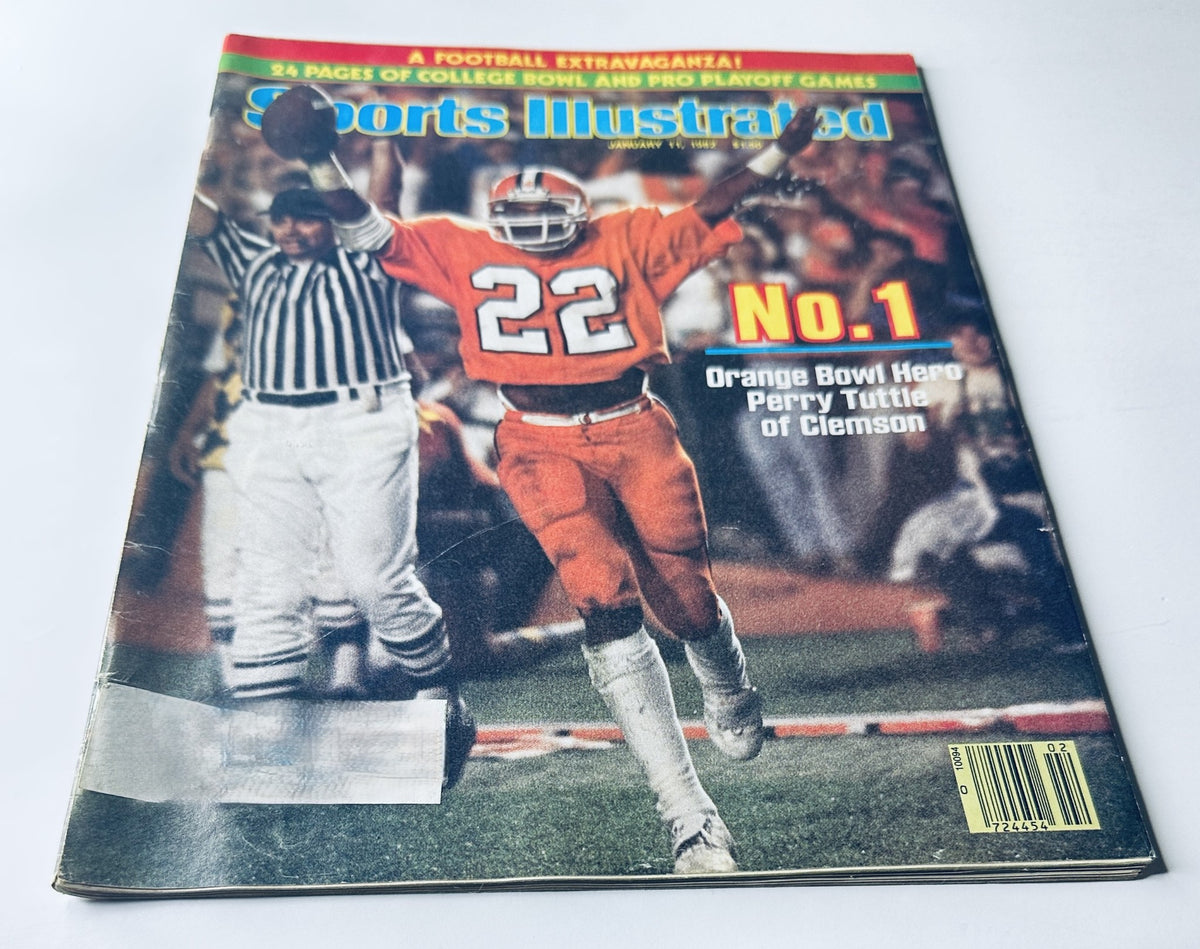 Cover of Sports Illustrated Magazine January 11, 1982 featuring Perry Tuttle from Clemson celebrating the Orange Bowl victory, showcasing bright orange uniforms and football referees.