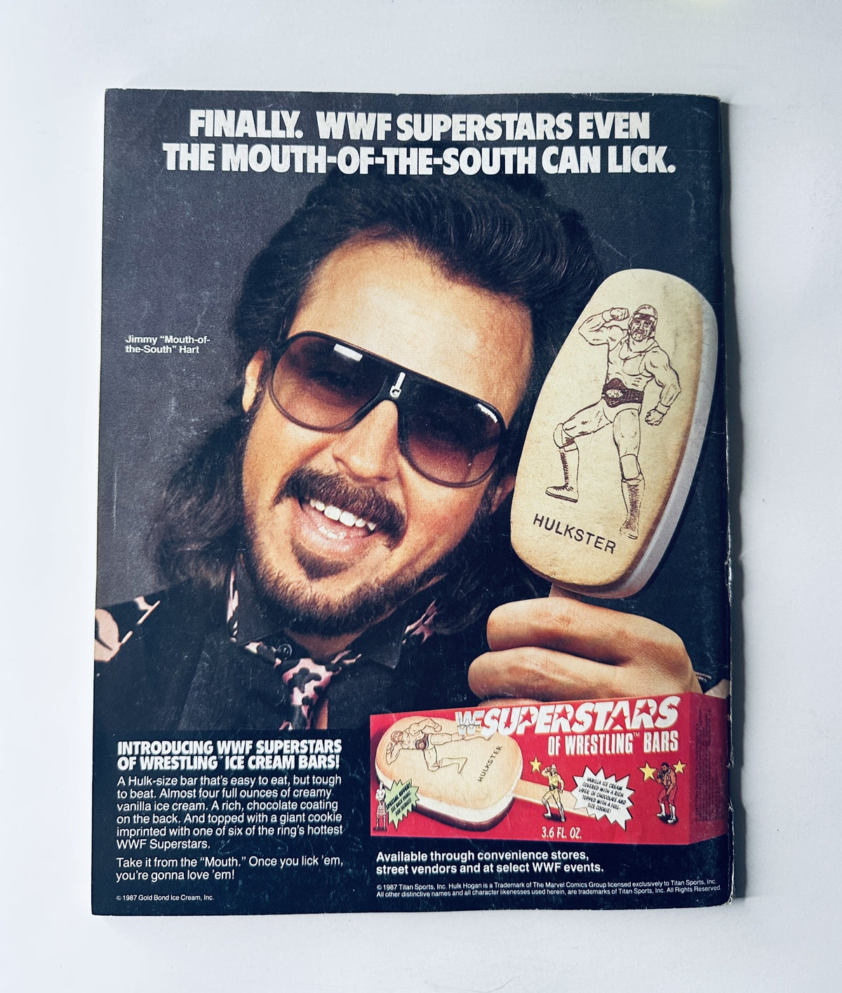 WWF Magazine November 1987 advertisement featuring a WWF wrestling ice cream bar, showcasing wrestler-themed merchandise. The promotion highlights Jimmy Hart with the slogan 'Finally, WWF Superstars Even the Mouth-of-the-South Can Lick'.