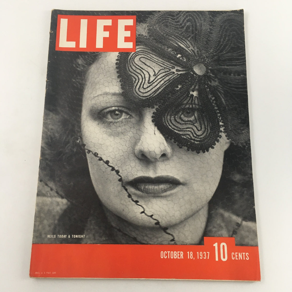 Cover of VTG Life Magazine from October 18, 1937, featuring a woman in a dramatic veil for the 'Veils Today and Tonight' feature, showcasing vintage fashion from the 1930s.