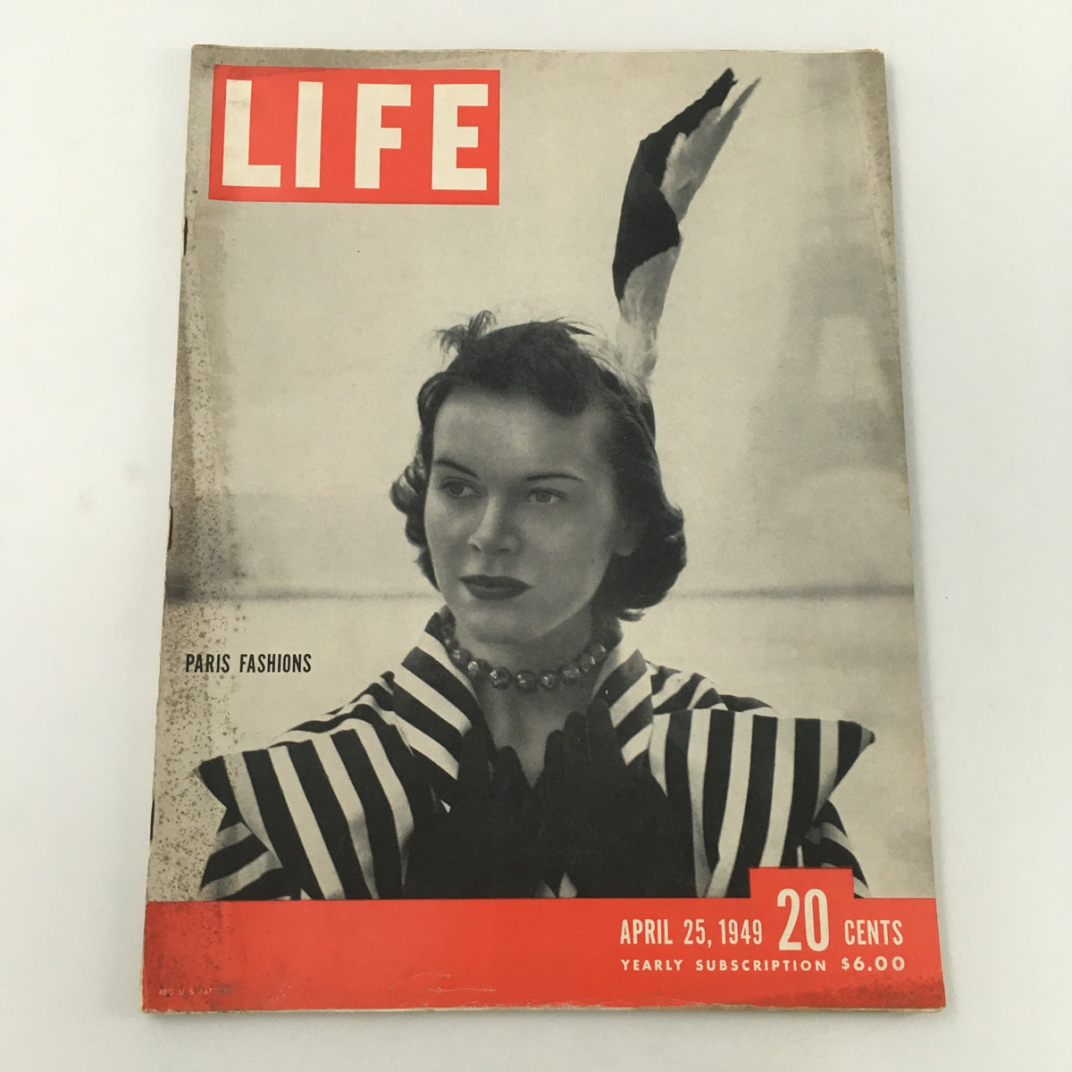 VTG Life Magazine April 25 1949 Paris Fashion Week cover featuring a model in a striped dress and feathered headpiece.