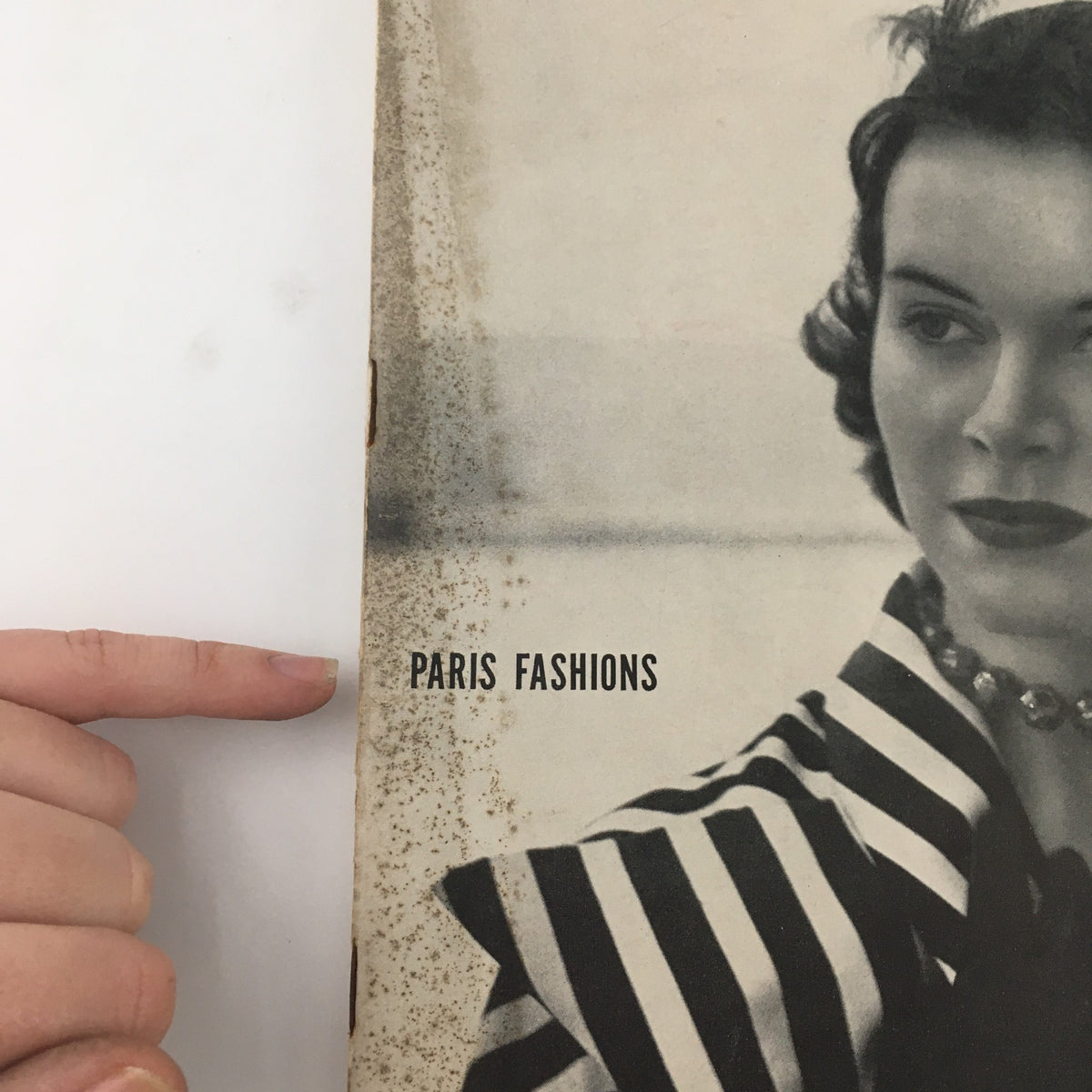 Close-up of the VTG Life Magazine April 25 1949 cover highlighting the text 'PARIS FASHIONS' next to a model adorned in elegant vintage attire.