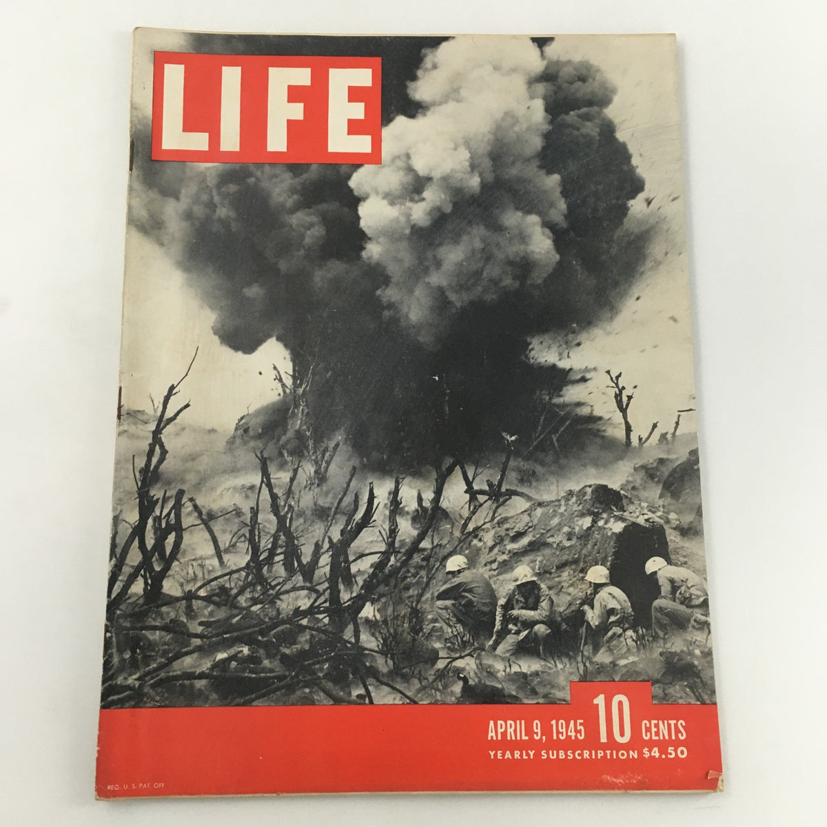 Vintage Life Magazine cover from April 9, 1945, featuring a dramatic photograph of an explosion during the Battle of Iwo Jima, showcasing soldiers in the foreground and smoke billowing from the background, highlighting historical wartime imagery.