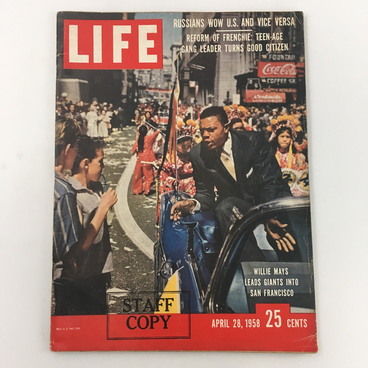 Life Magazine cover from April 28, 1958 featuring Willie Mays leading the San Francisco Giants, with a vibrant street parade backdrop and 'STAFF COPY' stamp.