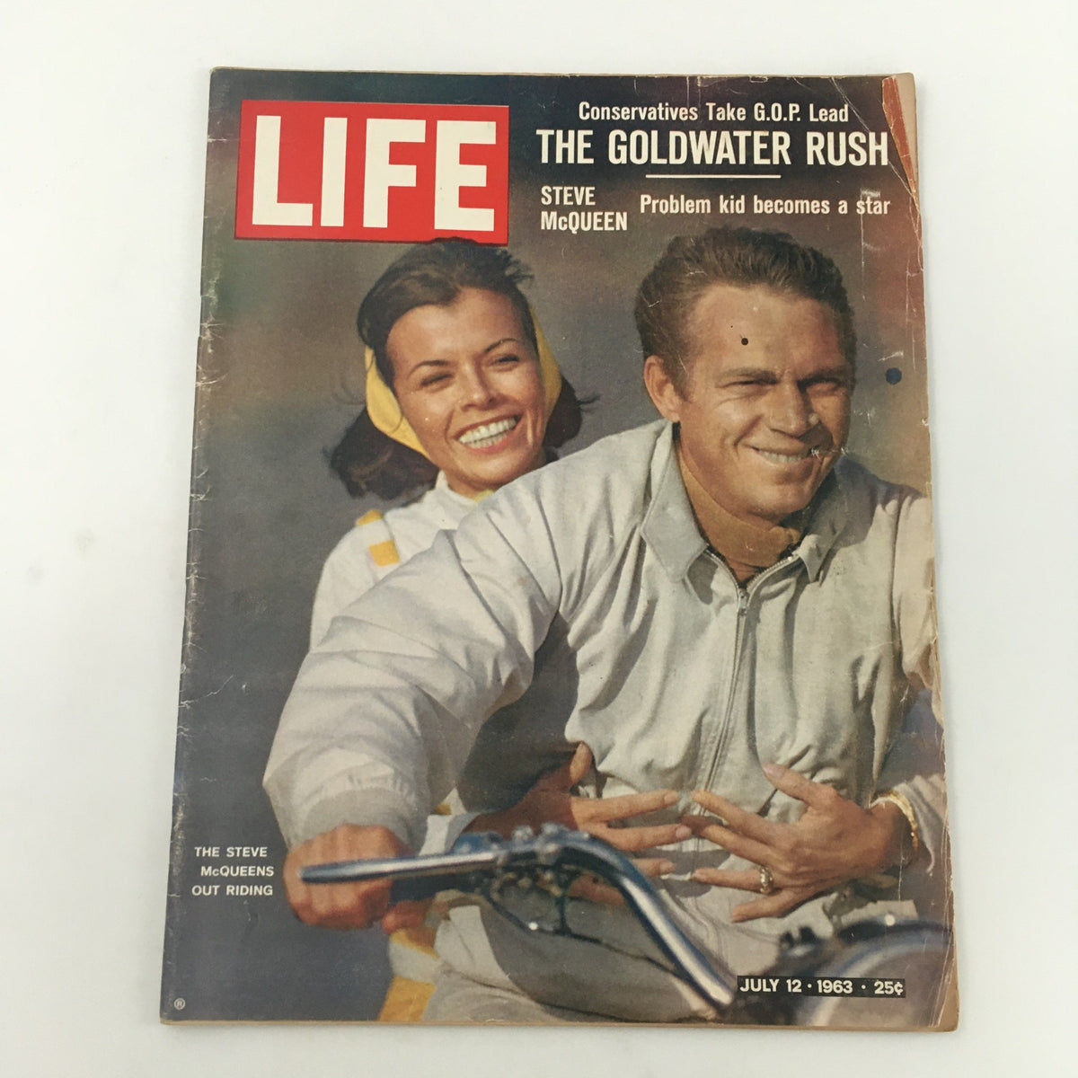 Vintage Life Magazine cover from July 12, 1963 featuring Steve McQueen with the title 'Problem Kid Becomes Star'. The cover includes a smiling woman in a yellow headband behind McQueen.