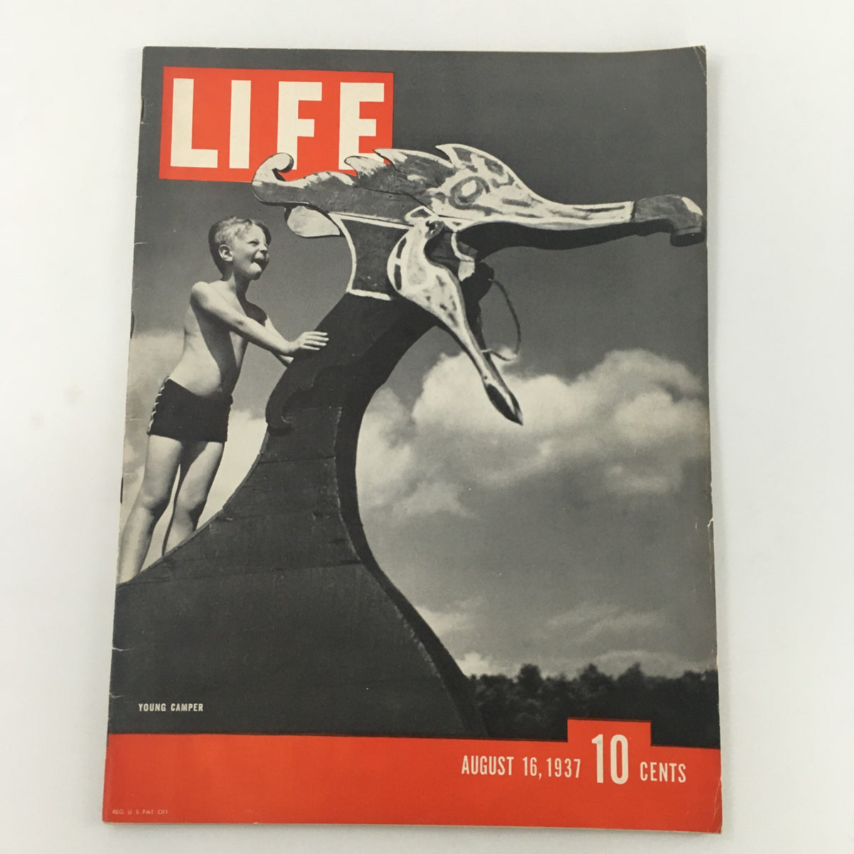 Cover of VTG Life Magazine from August 16, 1937, featuring a young boy camper playing on a decorative feature, illustrating the spirit of summer camp adventures.