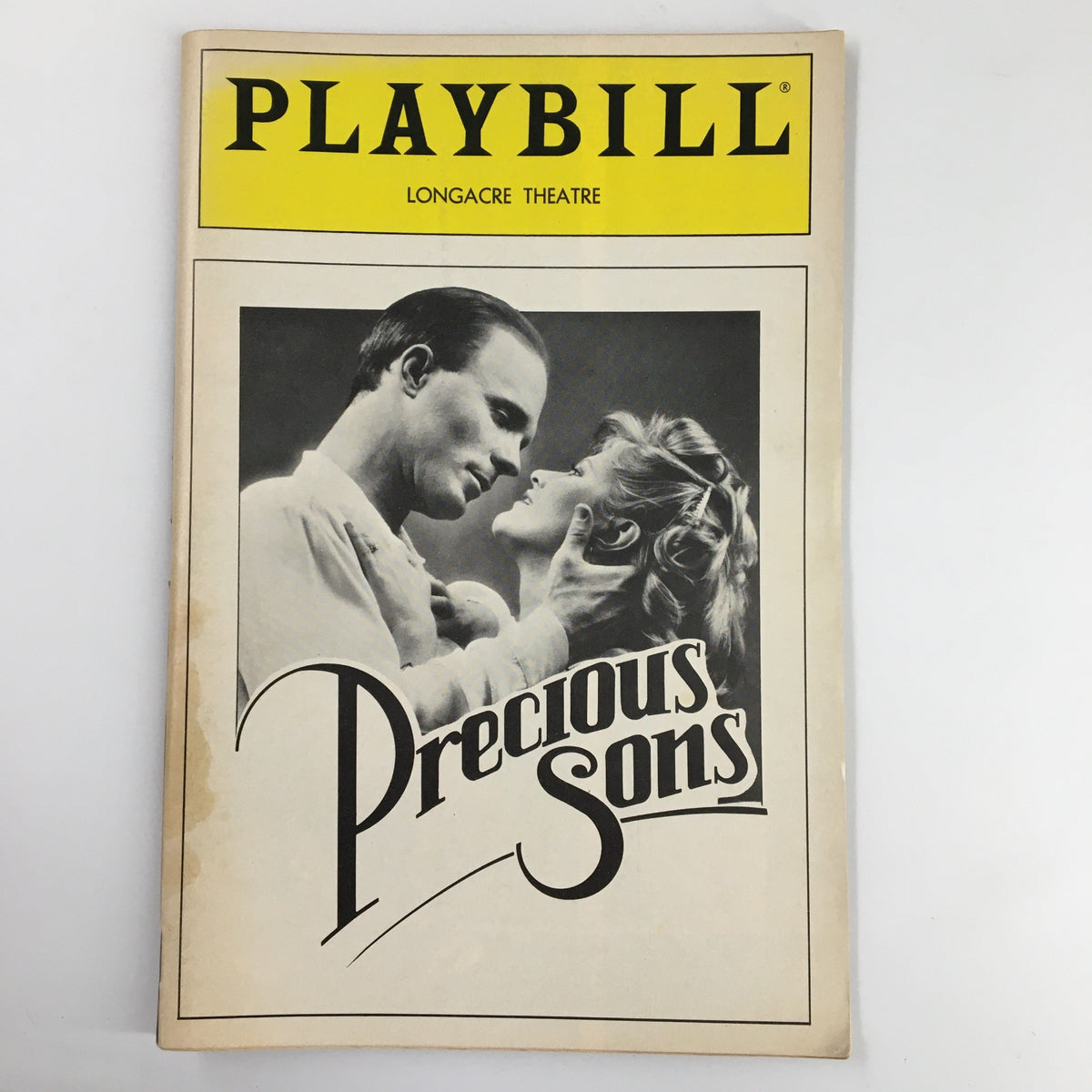 1986 Playbill for 'Precious Sons' by Norman Rene, featuring the Longacre Theatre logo and a romantic image of two characters, starring Ed Harris.