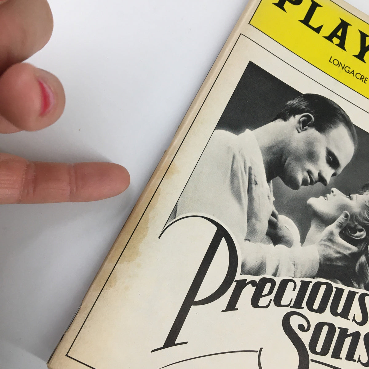 Cover of the 1986 Playbill Longacre Theatre Vol 86 #3 featuring Ed Harris in Precious Sons by Norman Rene, showcasing a dramatic design.