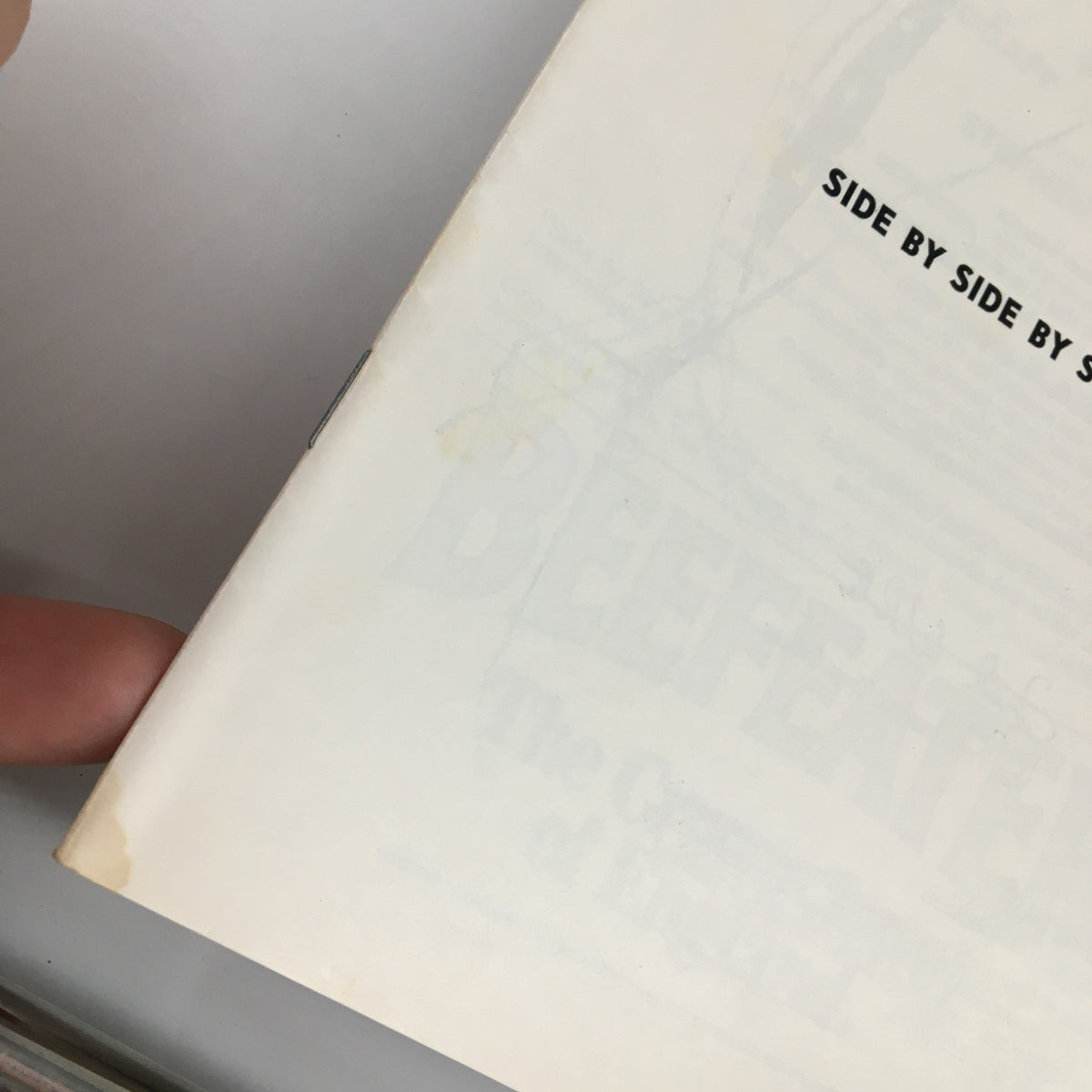 Close-up of the edge of the 1979 Playbill from Charles Playhouse, featuring Side by Side by Sondheim, displaying minor wear.