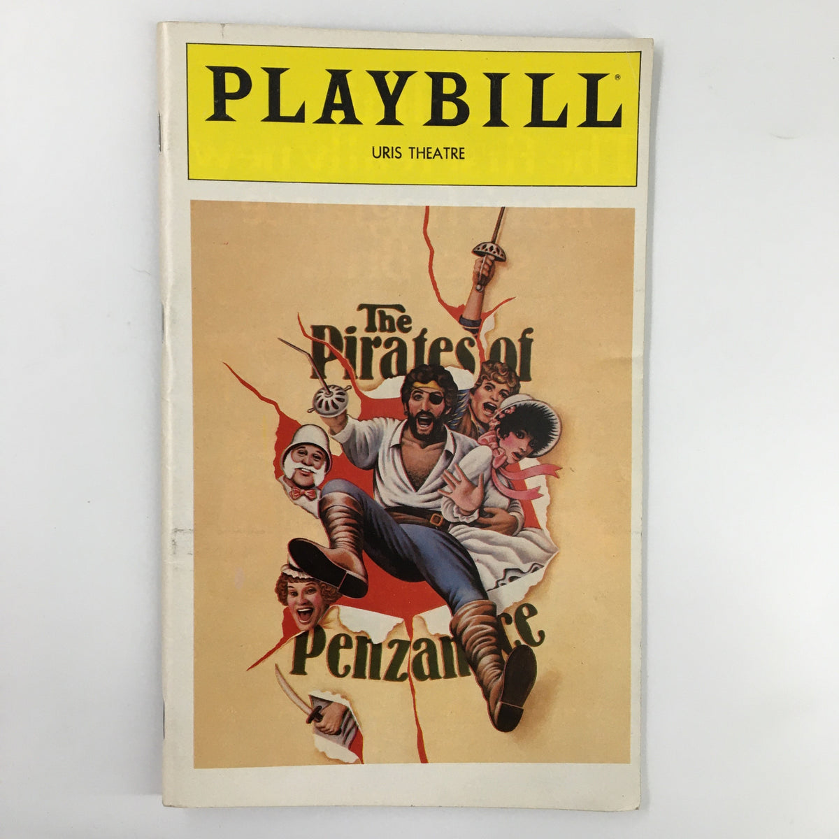 1980 Playbill for The Pirates of Penzance at Uris Theatre featuring vibrant artwork with characters from the musical breaking through the page.