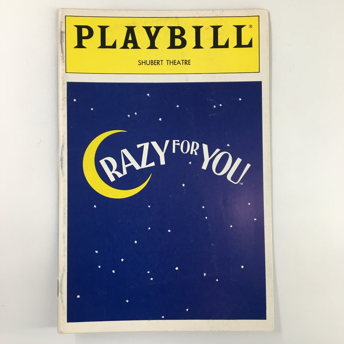 1992 Playbill for Crazy For You featuring a blue cover with a crescent moon and stars, from the Shubert Theatre.
