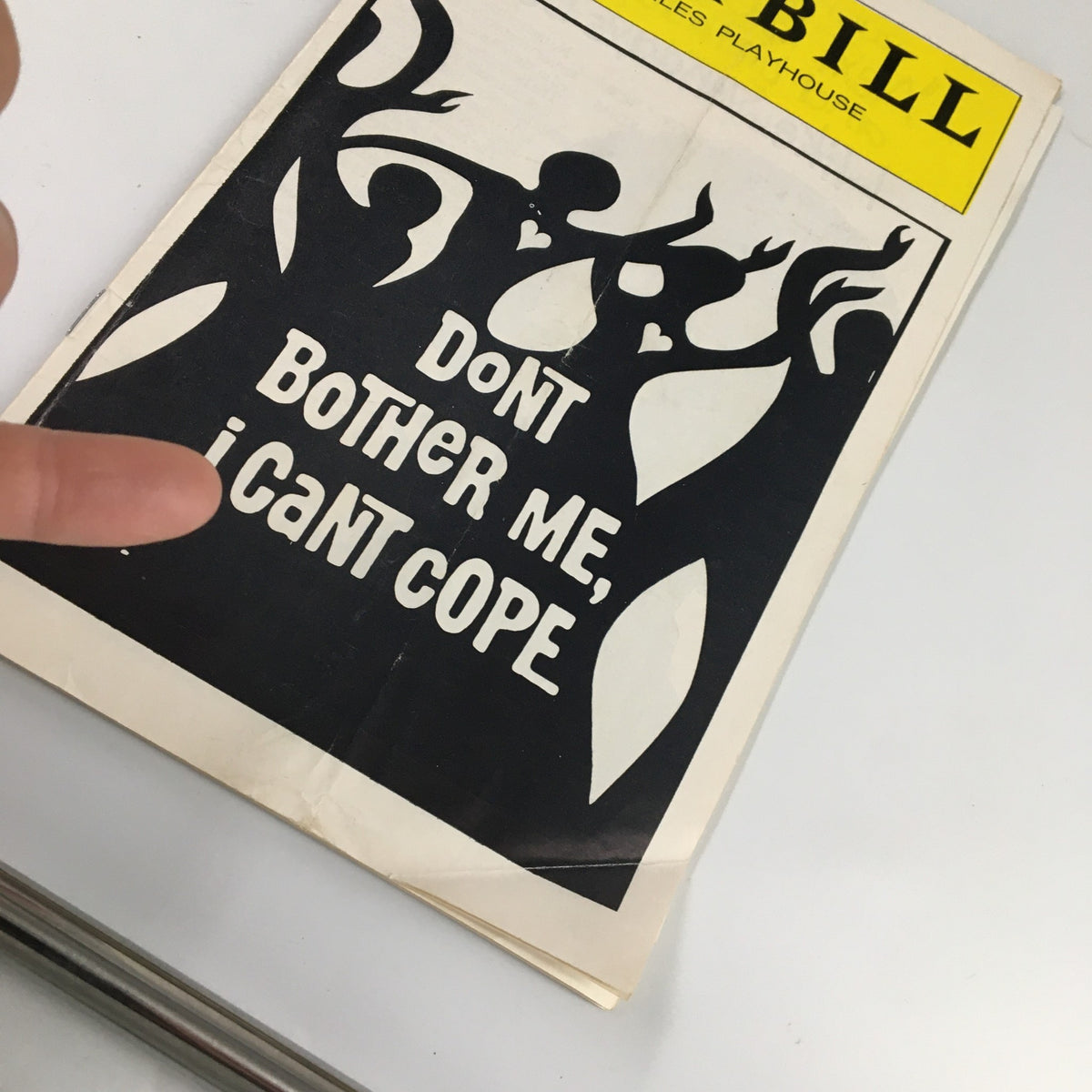 Close-up of 1976 Playbill for Don't Bother Me I Can't Cope, highlighting the cover artwork.