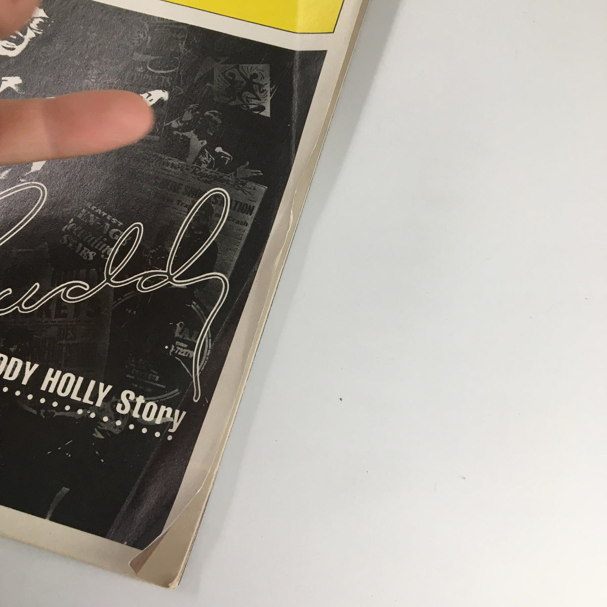 Close-up view of the 1991 Playbill for The Buddy Holly Story, showing the signature of Buddy Holly and the cover design.