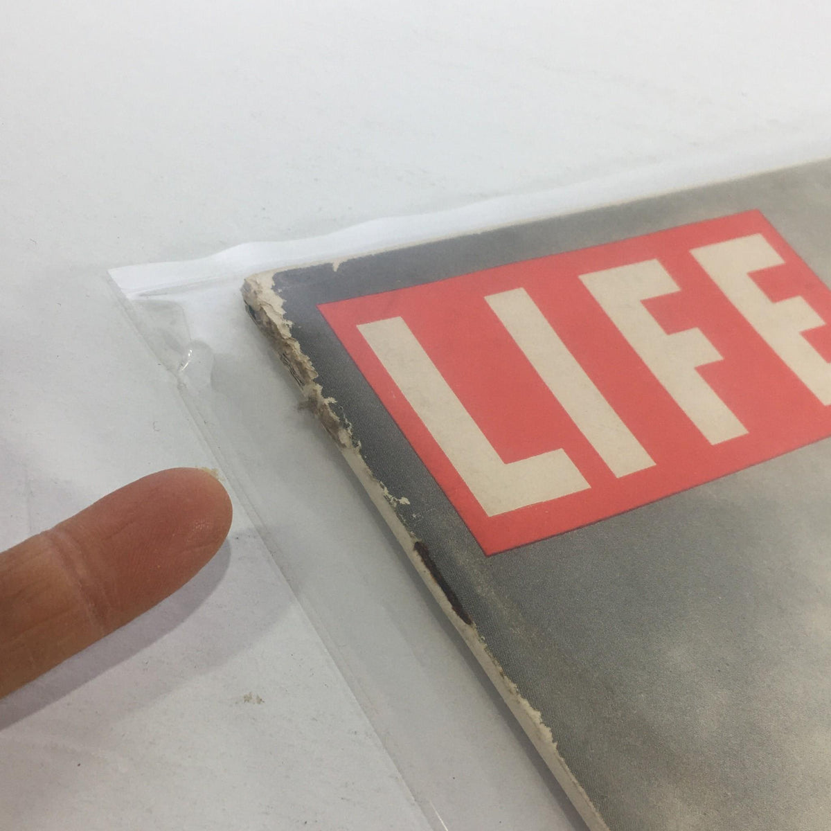 Close-up of the edge of the Vintage Life Magazine: March 17, 1941 - Panama Defense, displaying wear and tear indicative of its vintage condition.