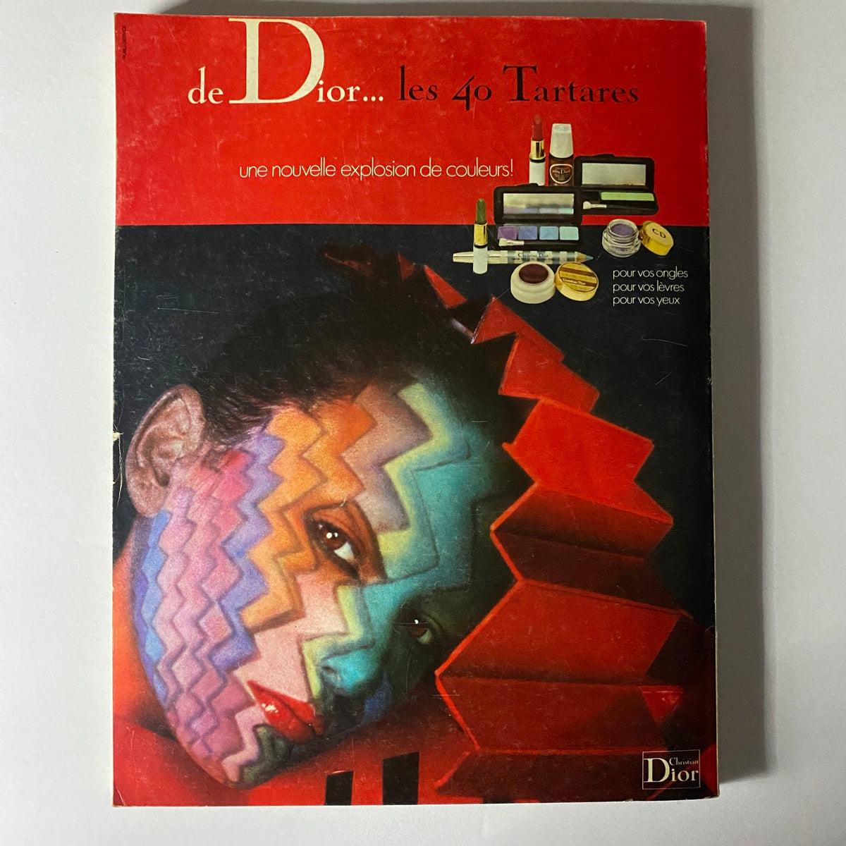 Dior promotional material featuring a colorful makeup design and art visuals, representing a vibrant cosmetic collection.