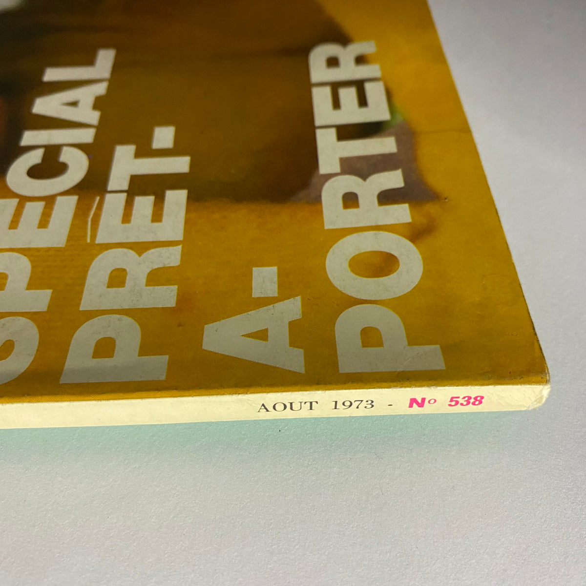 Close-up of the Vogue Paris Magazine August 1973 spine featuring 'SPECIAL PRET-A-PORTER' and issue number 538, highlighting its collectible nature.