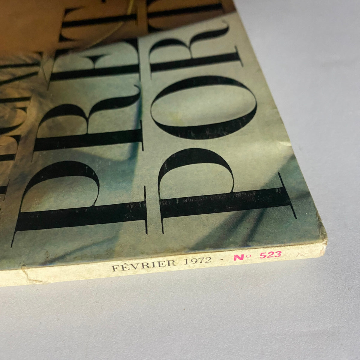 Side view of Vogue Paris Magazine February 1972 highlighting the publication date and label details.