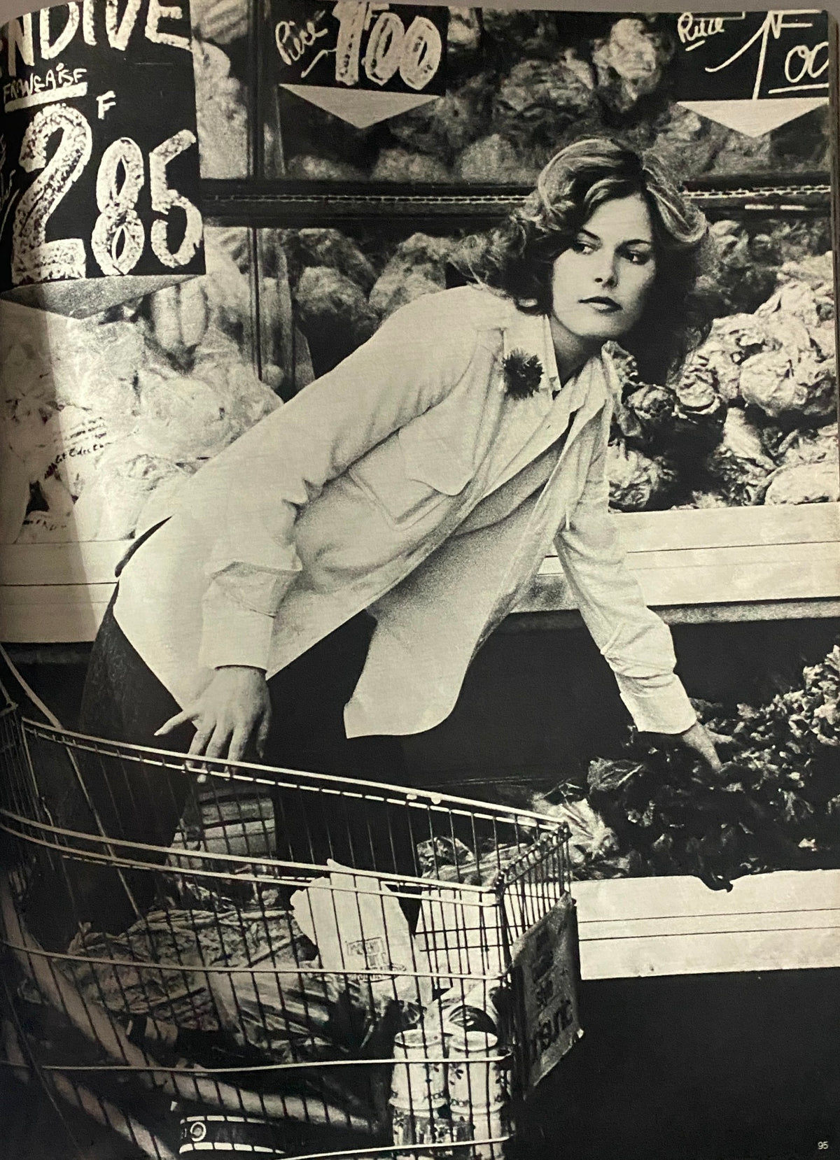 Vogue Paris Magazine February 1972 Catherine Deneuve Cover depicting a woman shopping at a market, embodying retro style and elegance.