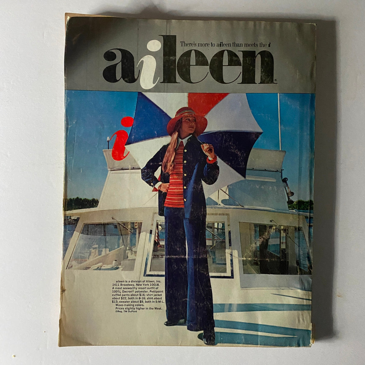 Vogue Magazine December 1972 Cher Cover highlighting the Aileen magazine featuring a model under a colorful umbrella, embodying nautical fashion trends.