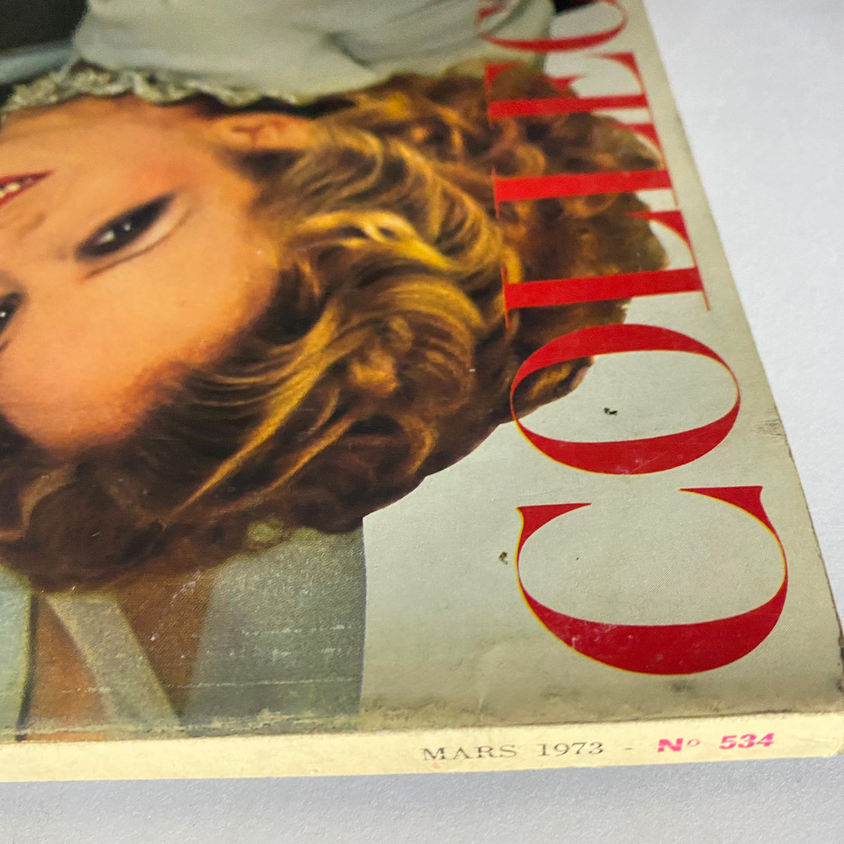 Cover of Vogue Paris Magazine March 1973 featuring Louise Despointe with vintage design elements and typography.