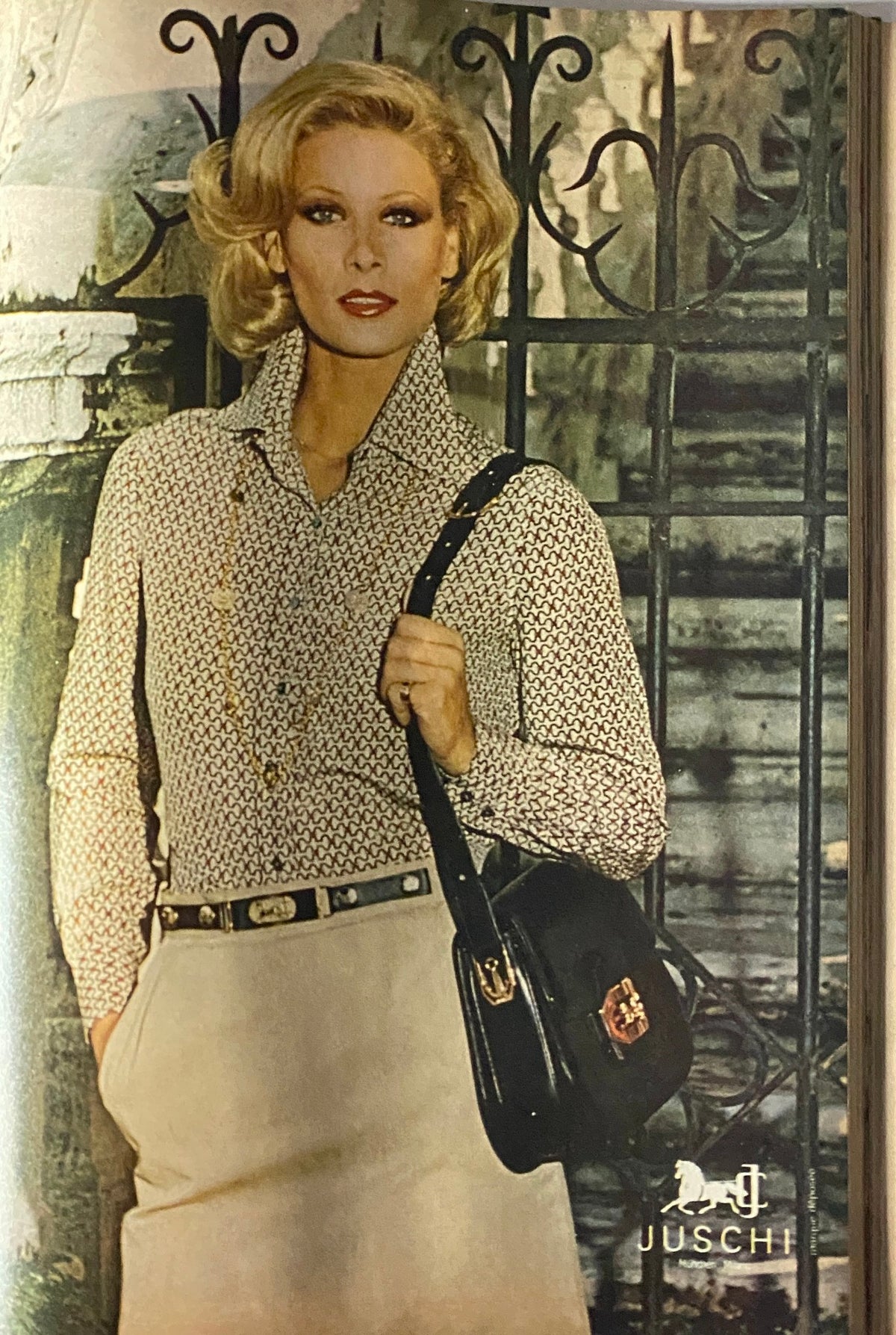 Vogue Magazine May 1977 featuring a glamorous model in a patterned blouse and stylish handbag, epitomizing 1970s fashion elegance.