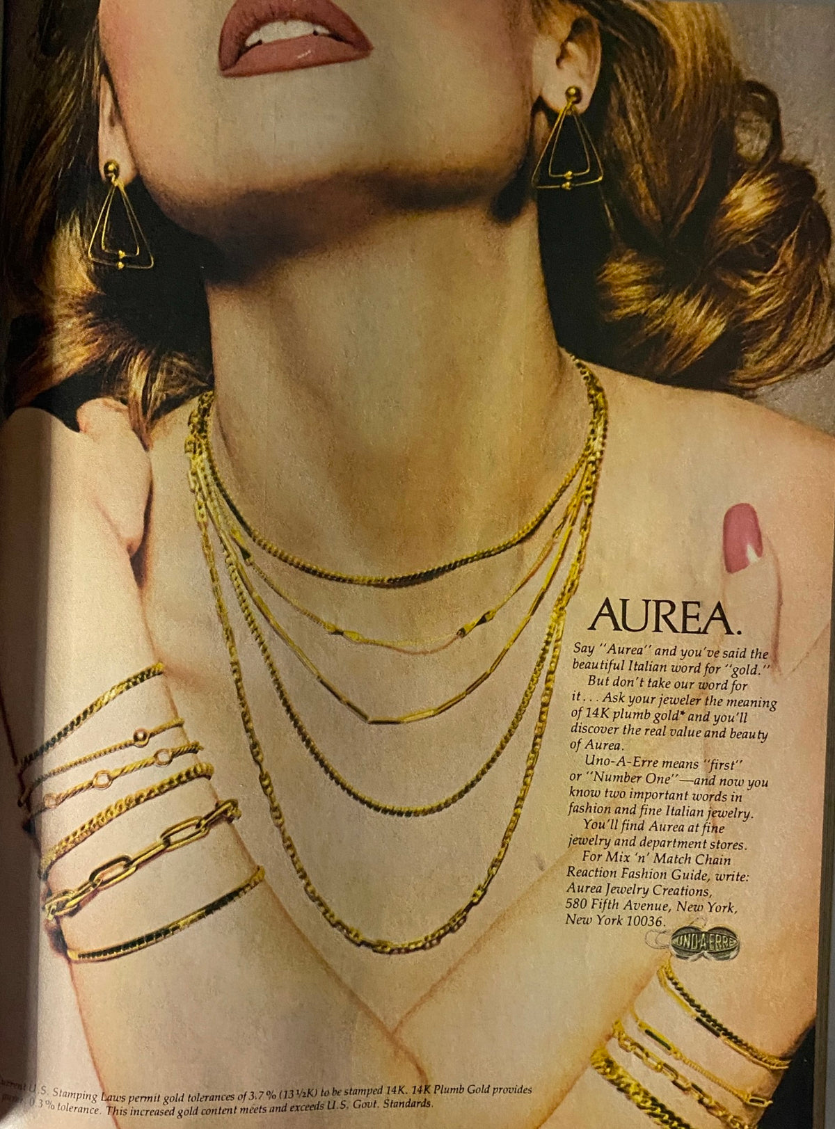 Aurea gold jewelry advertisement in Vogue Magazine June 1977, highlighting intricate gold necklaces and earrings, showcasing luxury fashion jewelry from the 1970s.
