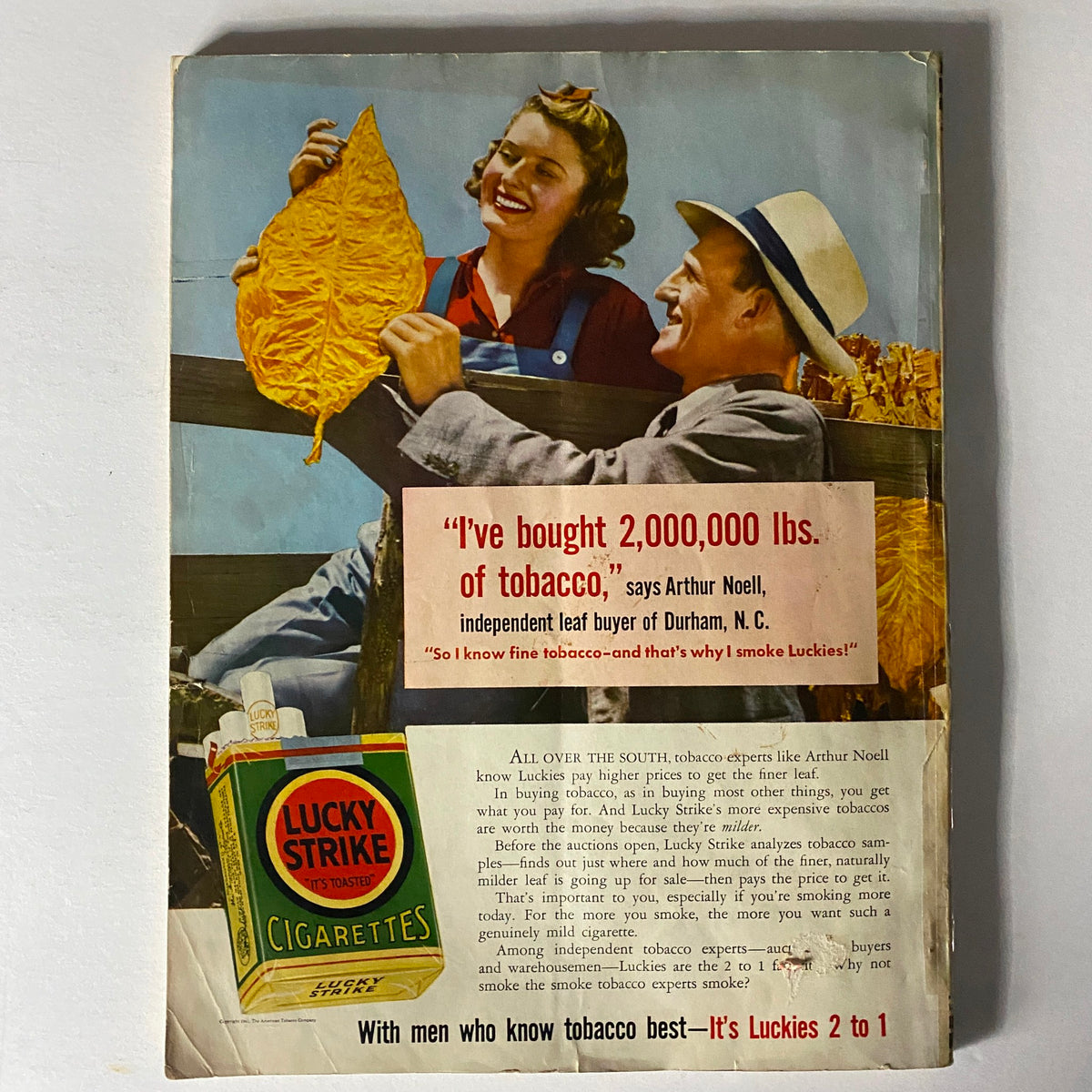 Back cover of Mademoiselle Magazine January 1941 Travel and Resort Number displaying a tobacco advertisement featuring two cheerful individuals.