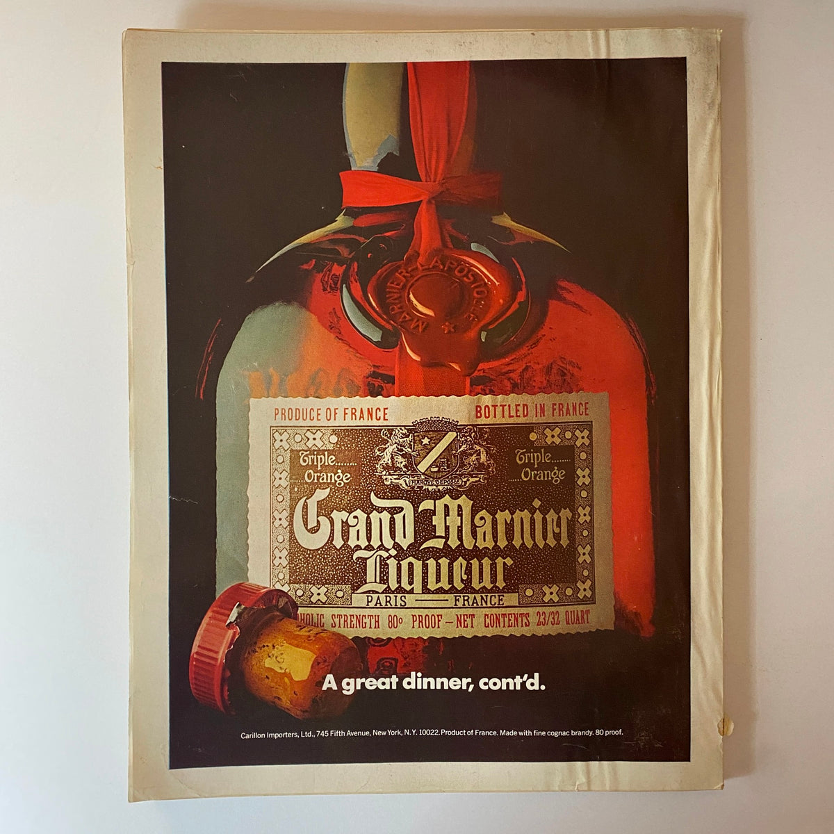 Vogue Magazine February 1976 Rosie Vela Cover featuring an artistic advertisement for Grand Marnier Liqueur, presenting a bottle with an elegant design.