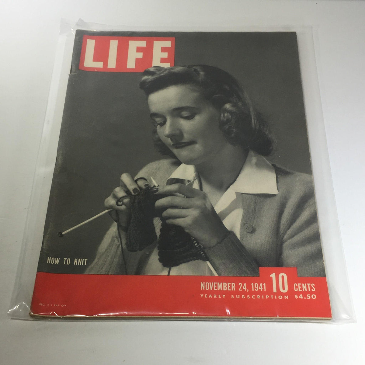 Vintage Life Magazine: November 24, 1941 cover featuring a woman knitting. This magazine showcases an article titled 'How To Knit' and is part of a yearly subscription with a price of $4.50.