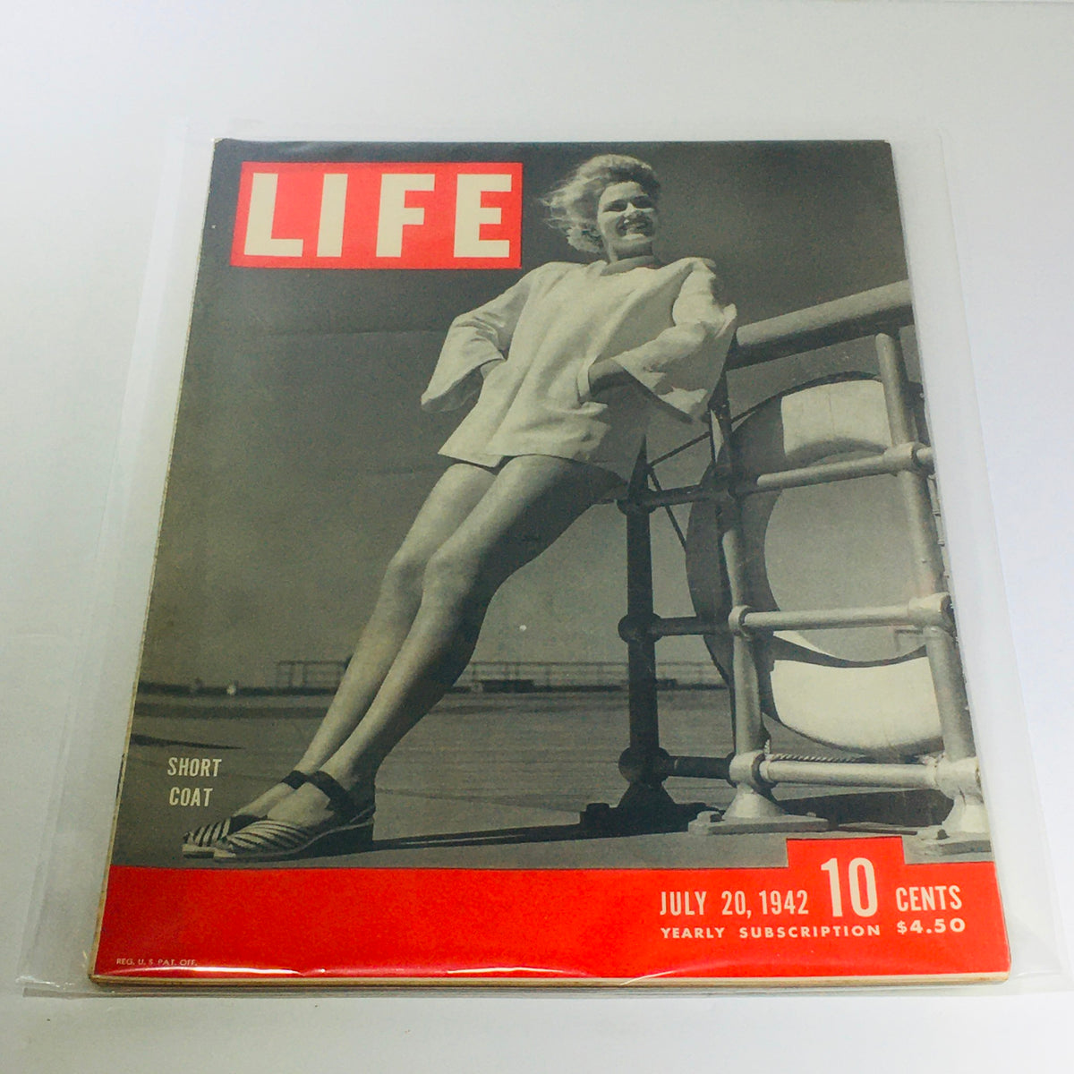 Cover of Vintage Life Magazine: July 20, 1942 featuring a model in a short coat, highlighting retro fashion and WWII advertising, collectible vintage magazine.