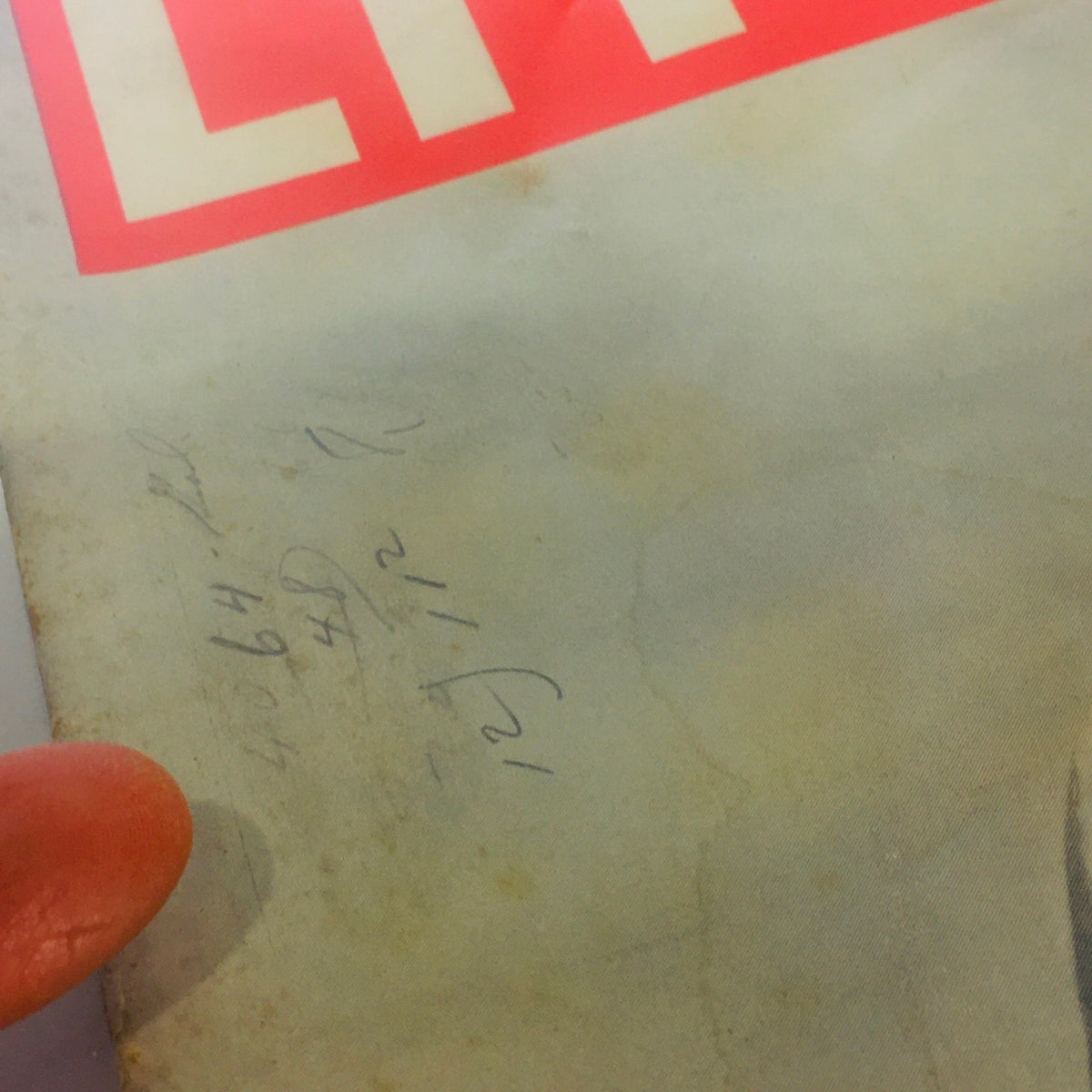 Close-up of the cover of Vintage Life Magazine: July 13 1942, showing wear and original notes, capturing the magazine's history and vintage appeal.