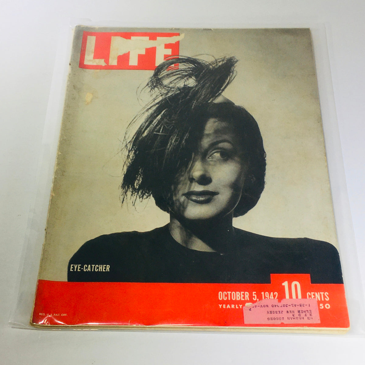 Vintage Life Magazine: Eye-Catcher - October 5, 1942. Cover features a classic black and white portrait of a woman with stylish hair, reflecting the era's fashion and culture during World War II. Perfect for collectors and vintage magazine enthusiasts.