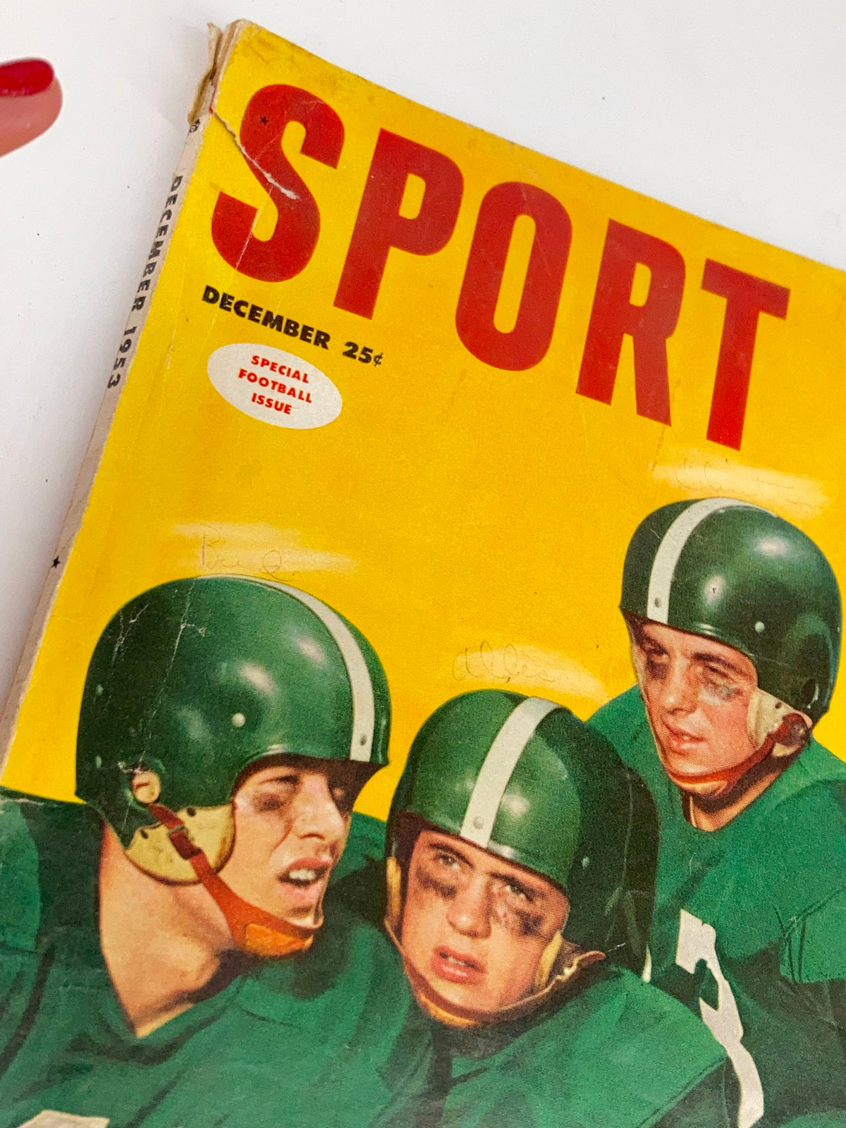 Close-up view of the cover of VTG Sport Magazine December 1953 Vol 15 #6 highlighting The Ben Hogan Story with details of the special football issue.