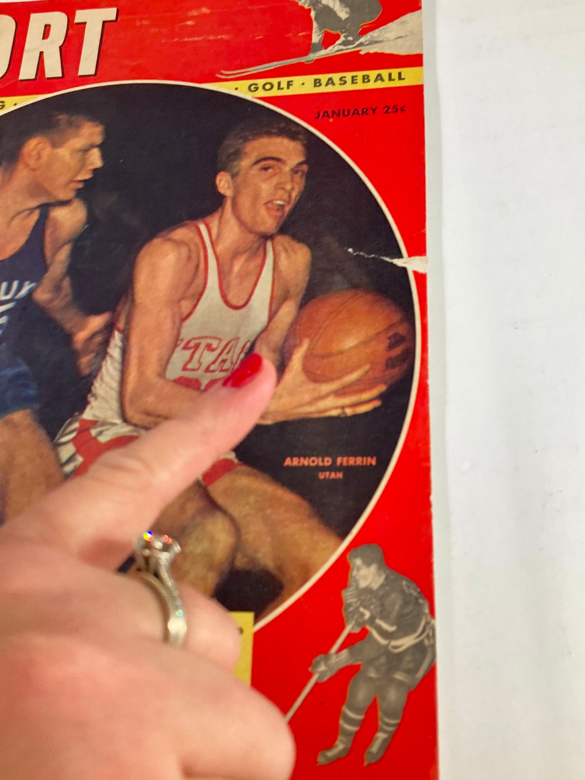 Close-up of the cover of VTG Sport Magazine January 1948, showcasing Arnold Ferrin with a basketball, part of a vintage sports collection.