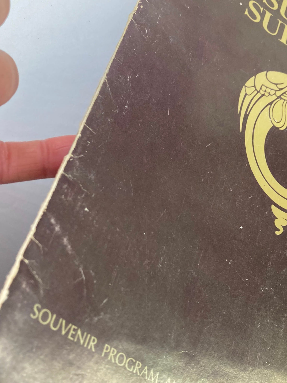 Close-up of the 1970 Jesus Christ Superstar Souvenir Program with visible wear and tear on the cover.