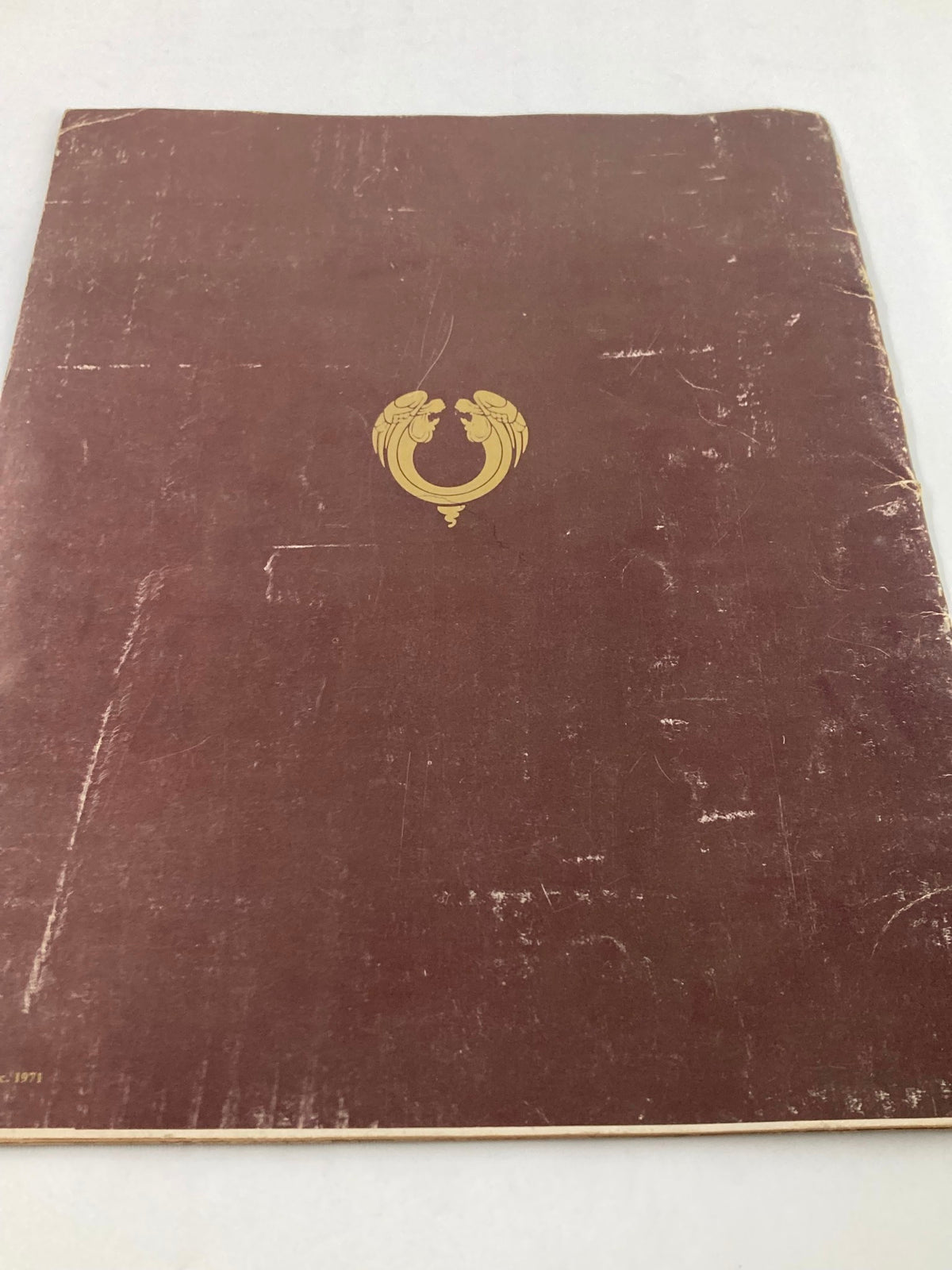 Back cover of the 1970 Jesus Christ Superstar Souvenir Program, featuring a simple design with a gold emblem.