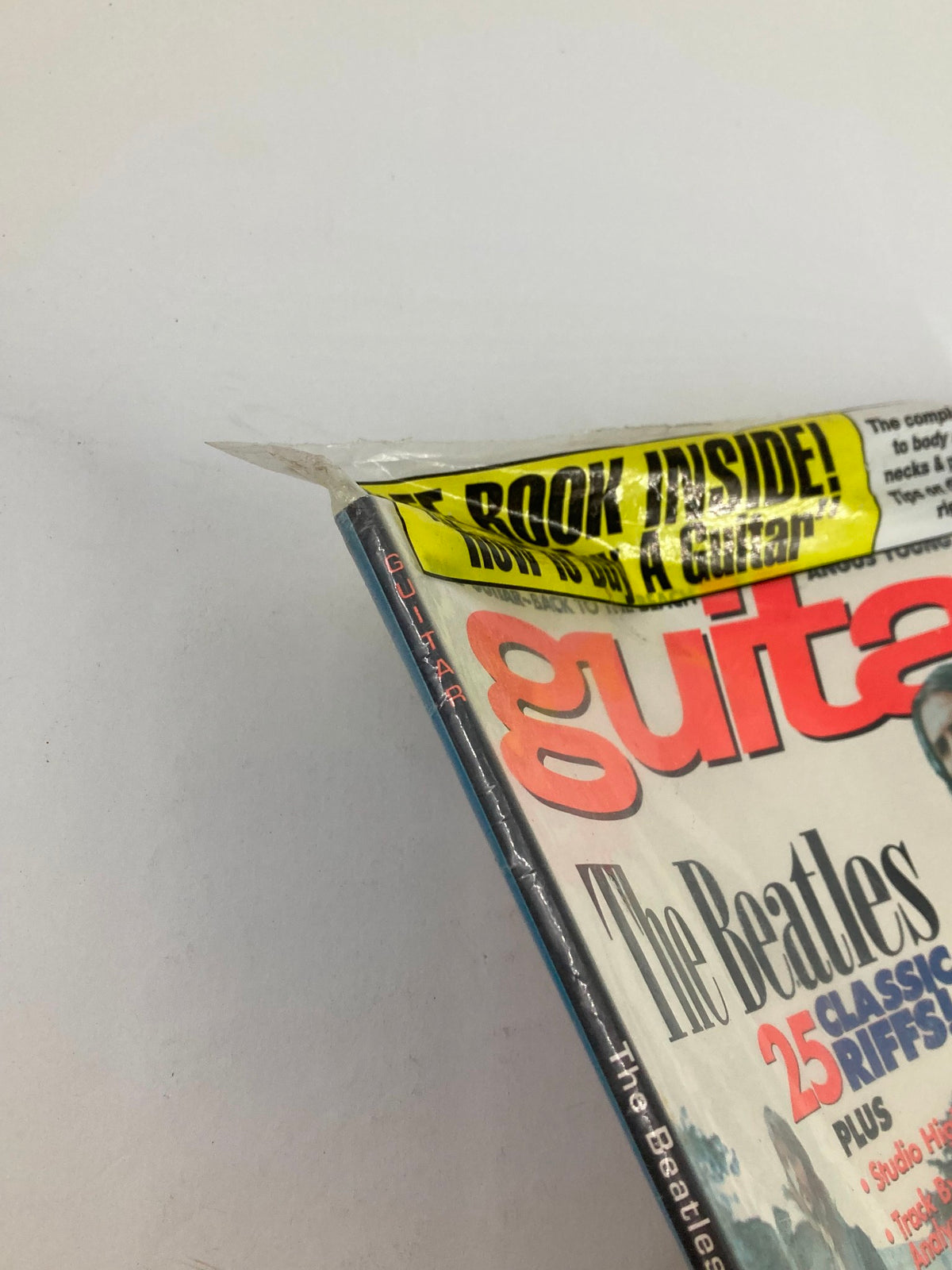 Side view of Guitar Magazine December 1995 clearly showing the seal and cover text indicating a special feature for guitar buyers.