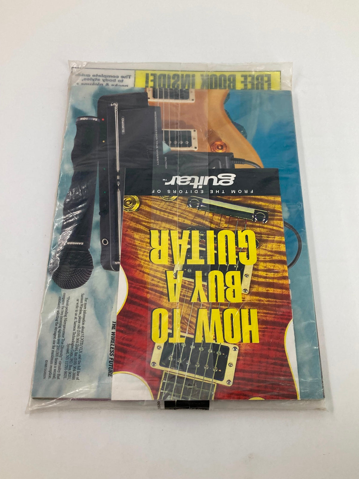 Back view of Guitar Magazine December 1995, showcasing the free book on guitar buying and vibrant images of musical instruments.