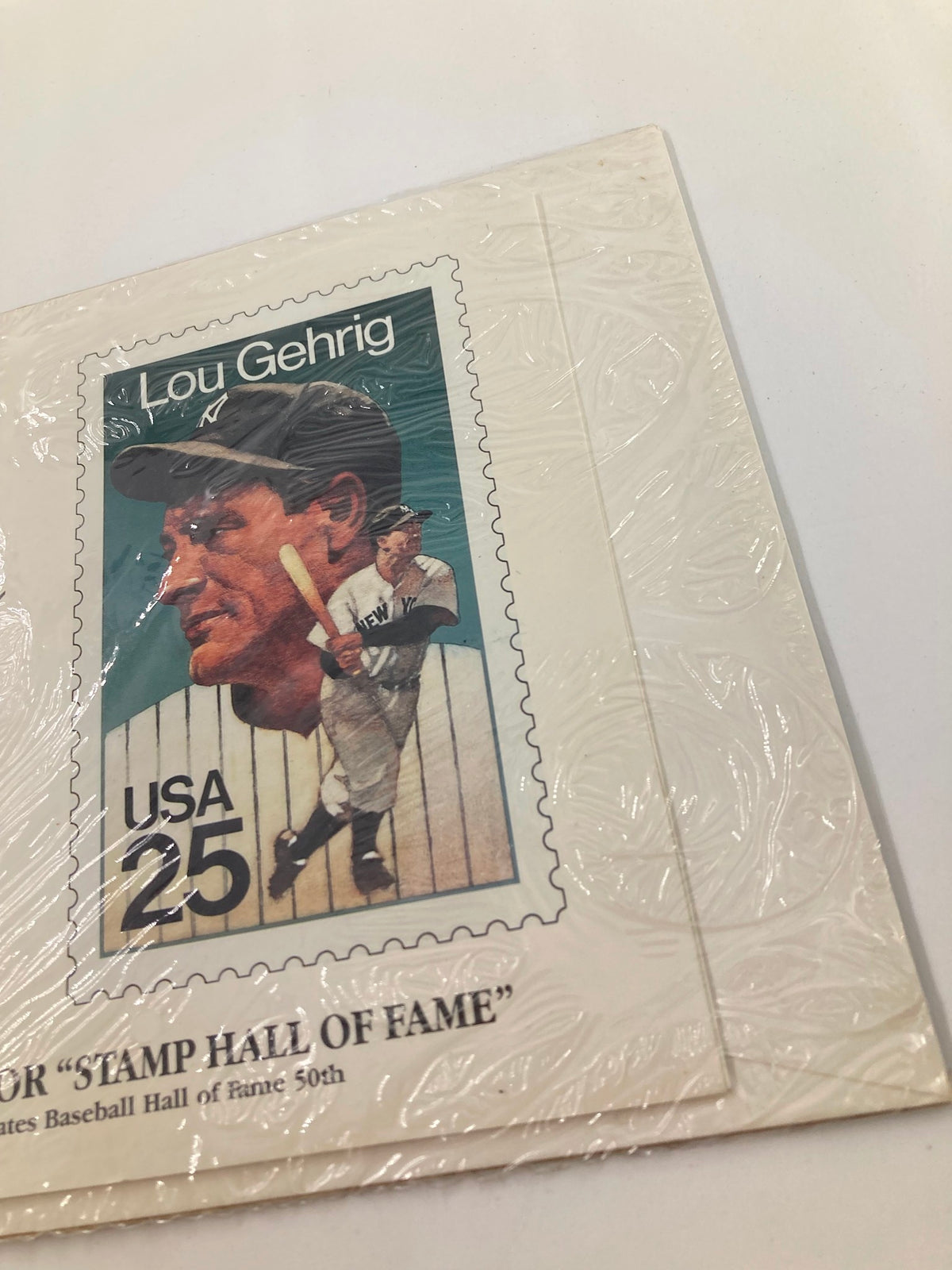 Close-up of a sealed commemorative envelope showcasing the 'Iron Horse' Lou Gehrig, selected for the 'Stamp Hall of Fame'. This image highlights a distinct stamp of Lou Gehrig, capturing his likeness and the phrase 'Lou Gehrig Selected for Stamp Hall of Fame' with 'USA 25' clearly visible.