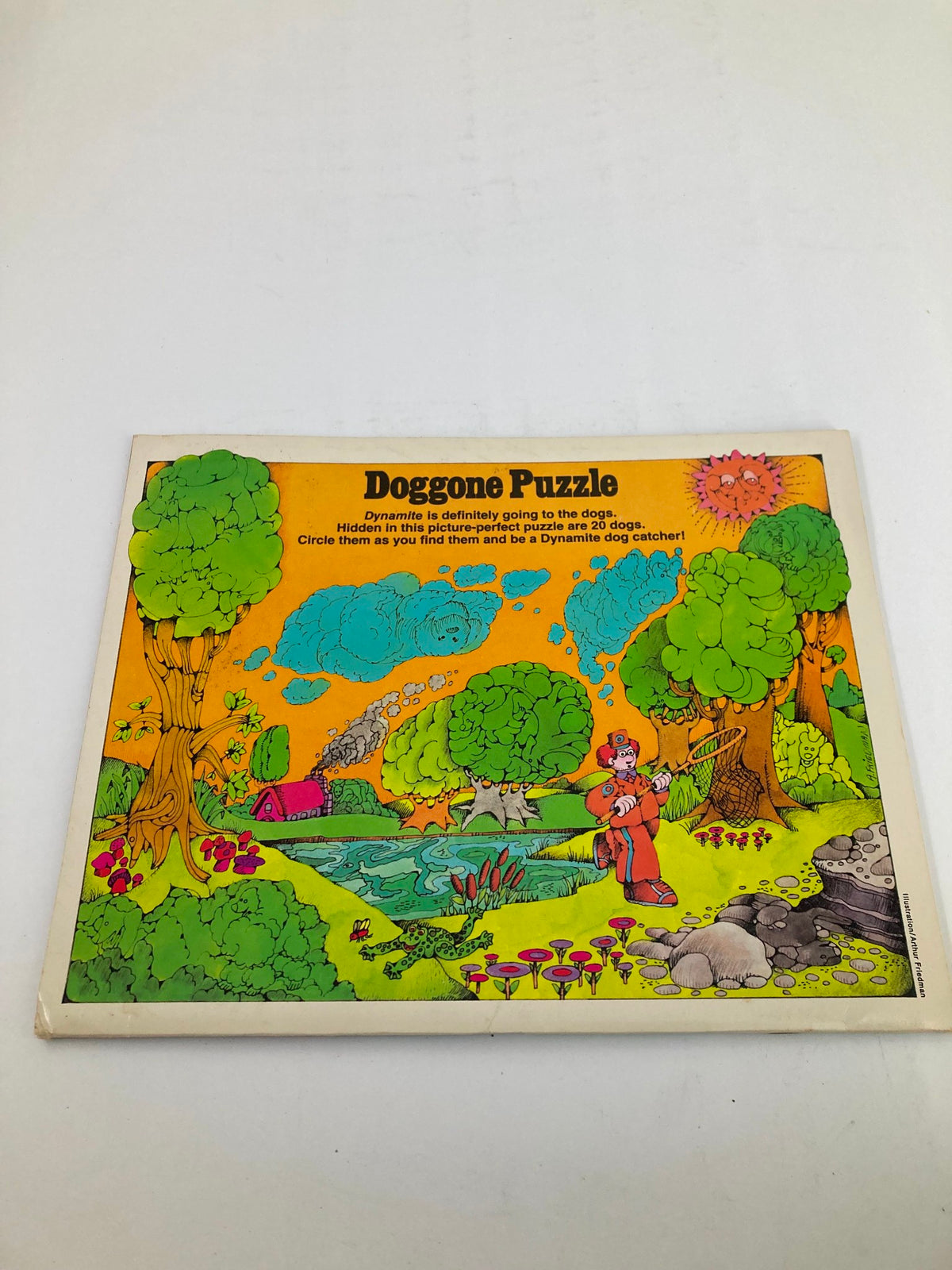 Back cover of VTG Dynamite Magazine No. 53 showcasing the 'Doggone Puzzle', an interactive feature inviting readers to find hidden dogs in a colorful illustration.