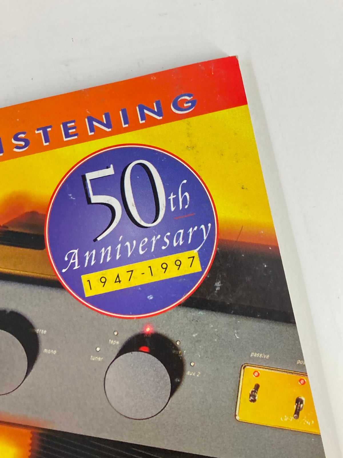 Close-up of the 50th Anniversary badge on the Audio Magazine, December 1997 edition, highlighting its historical significance.