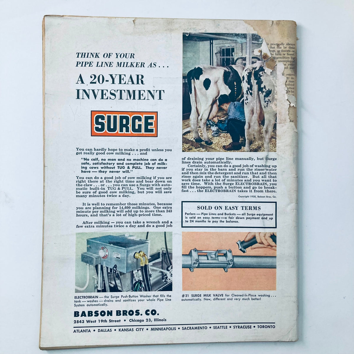 Back cover of the April 1958 issue of VTG The Progressive Farmer Magazine, showcasing an advertisement for Surge milkers, featuring a farmer milking a cow with visuals highlighting the investment benefits and features of the product.