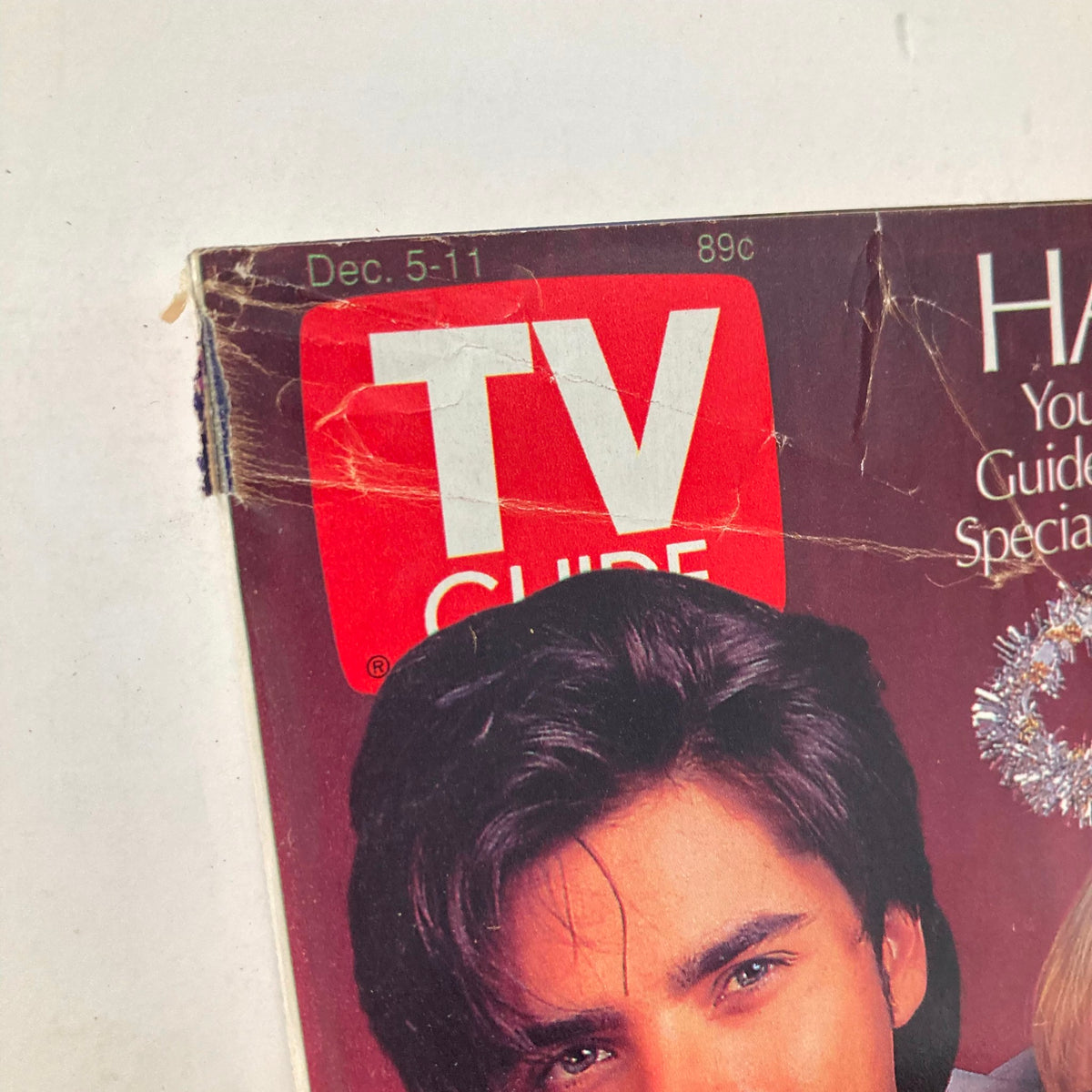 Close-up of the TV Guide Magazine December 5 1992 cover showing details of John Stamos's face and hair, highlighting vintage television culture.