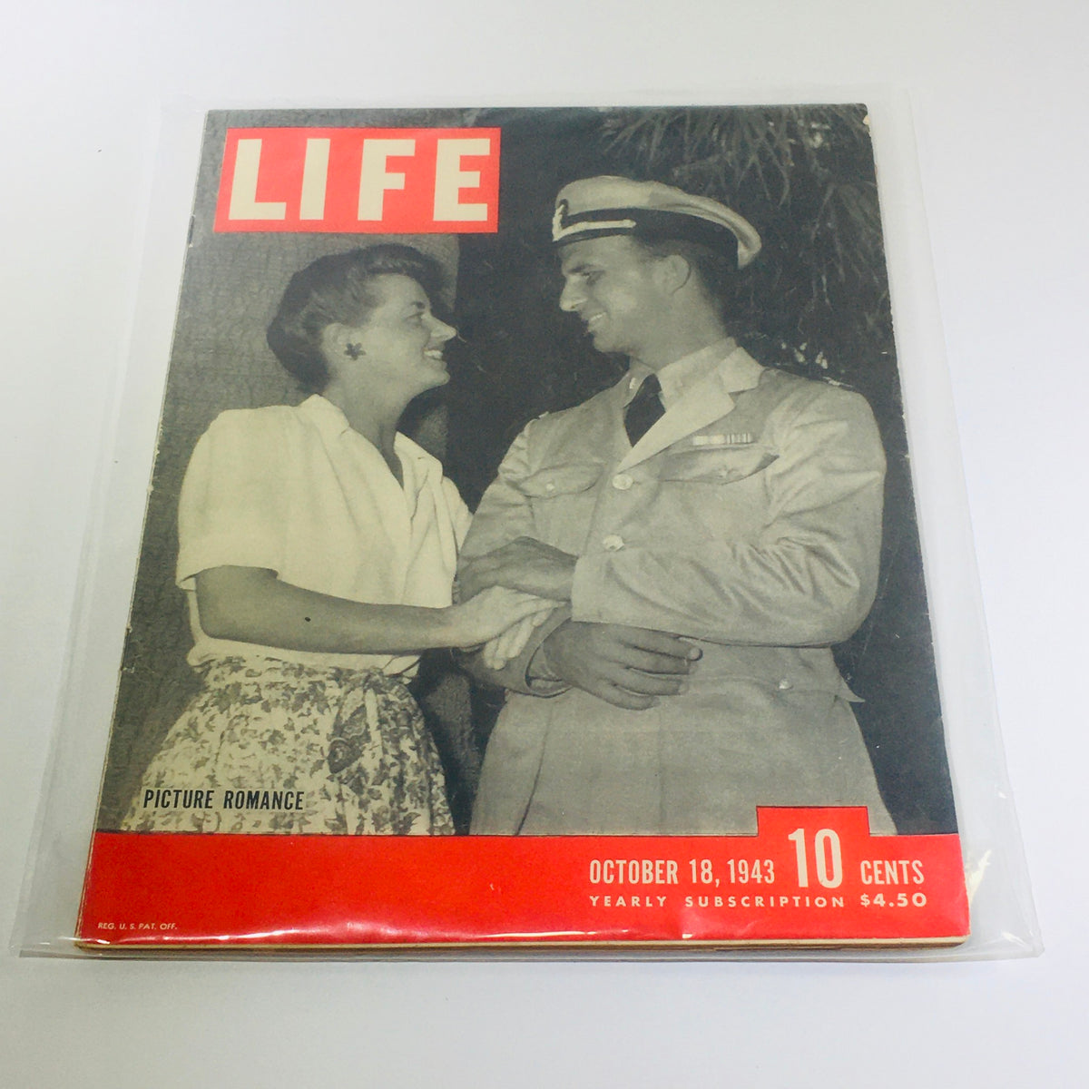 Vintage Life Magazine cover from October 19, 1943 featuring a romantic scene, showcasing a couple smiling at each other, with a military theme reflecting wartime dynamics.
