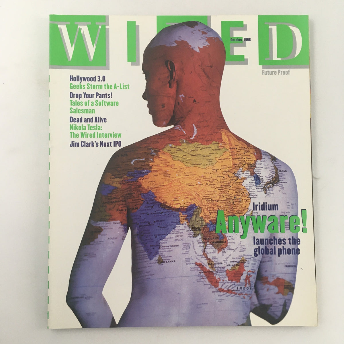 Wired Magazine October 1998 cover featuring the Wired Interview with Nikola Tesla, showcasing a graphic of a person with a world map on their body, highlighting themes of technology and innovation.