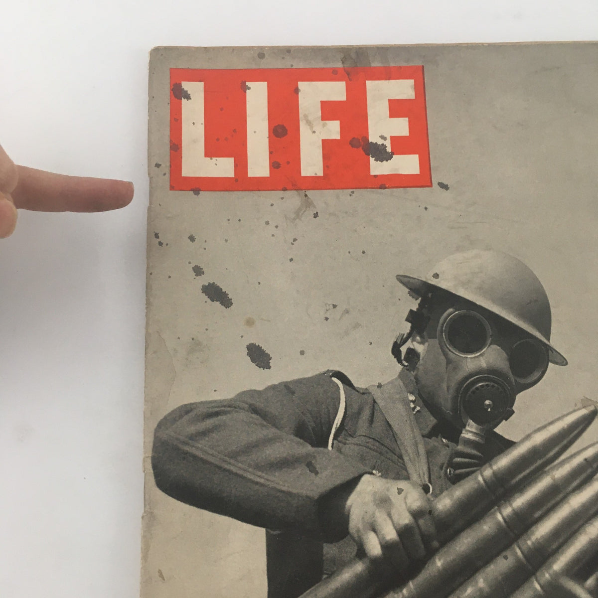 Detailed view of the cover of VTG Life Magazine from September 18, 1939, showcasing the title 'LIFE' in red, with a focus on a soldier in a gas mask and munitions, underlining the historical significance of 'Britain Goes To War.'