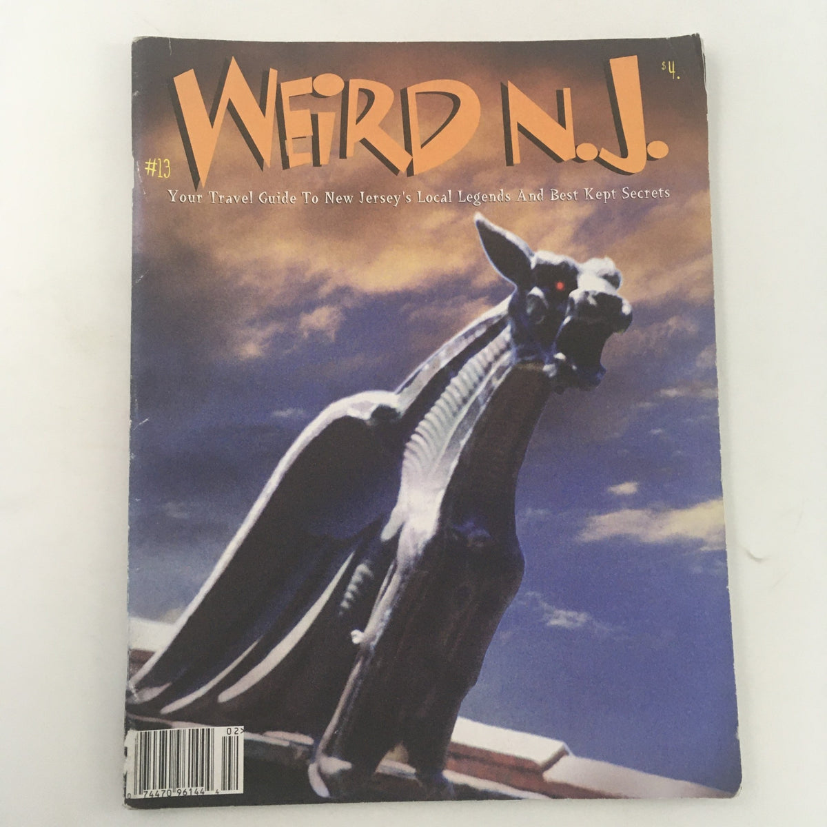 Cover of Weird N.J. Magazine 1999 Issue #13 featuring a striking image of a gargoyle against a dramatic sky, showcasing local legends and travel secrets from New Jersey.
