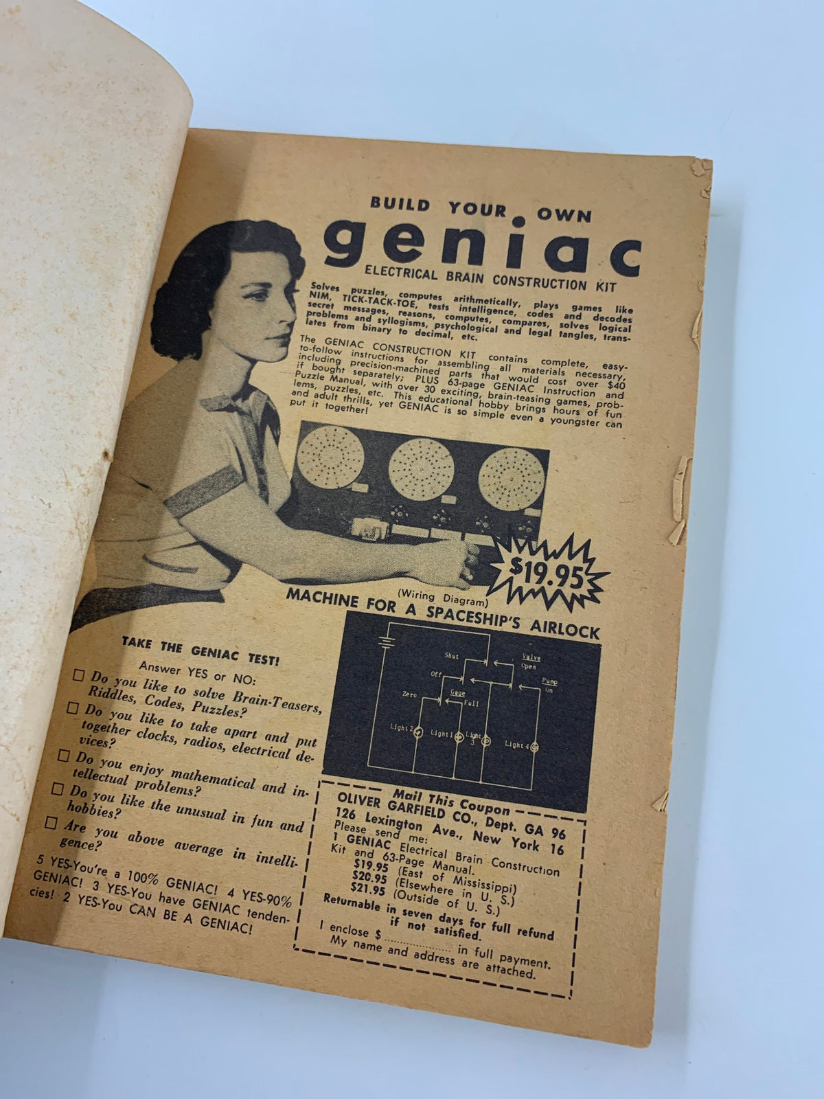 Inside page of VTG Galaxy Science Fiction Magazine October 1956 showcasing an advertisement for the Geniac Electrical Brain Construction Kit, reflecting mid-20th century interests in technology and innovation.