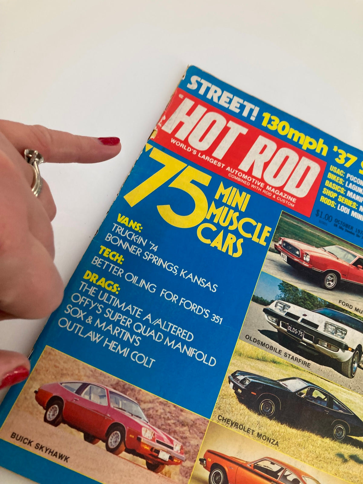 VTG Hot Rod Magazine October 1974 Vol 27 #10 cover with a finger pointing to the features of '75 Mini Muscle Cars including listings for various vehicles.